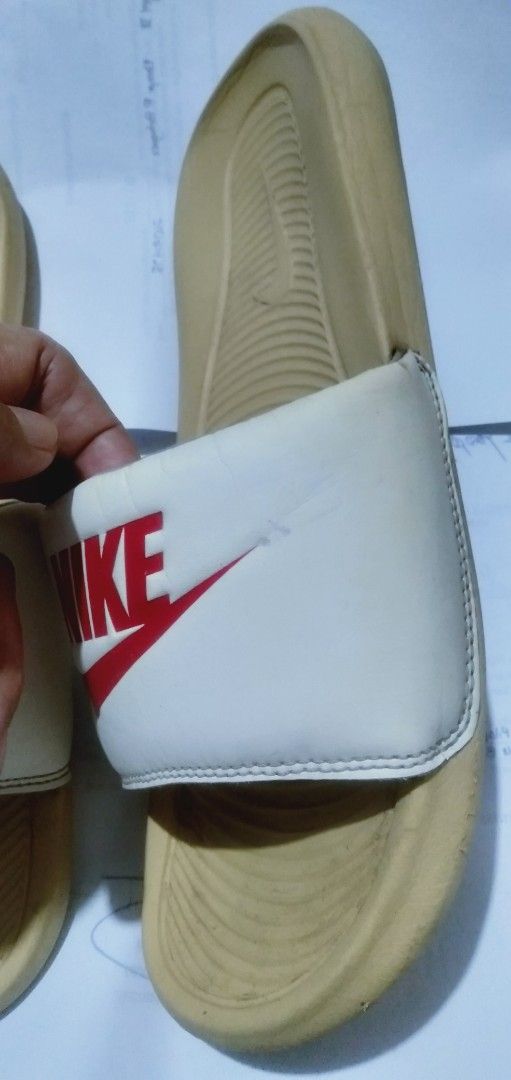 Authentic Nike Slide size 9 (Category: Slippers & Slides) located in Naga. Submitted by pec3c (Listing ID 1419945601, Image 2). Description: Authentic Nike Slide Size 9 No issues No reglue All good Needs Cleaning .