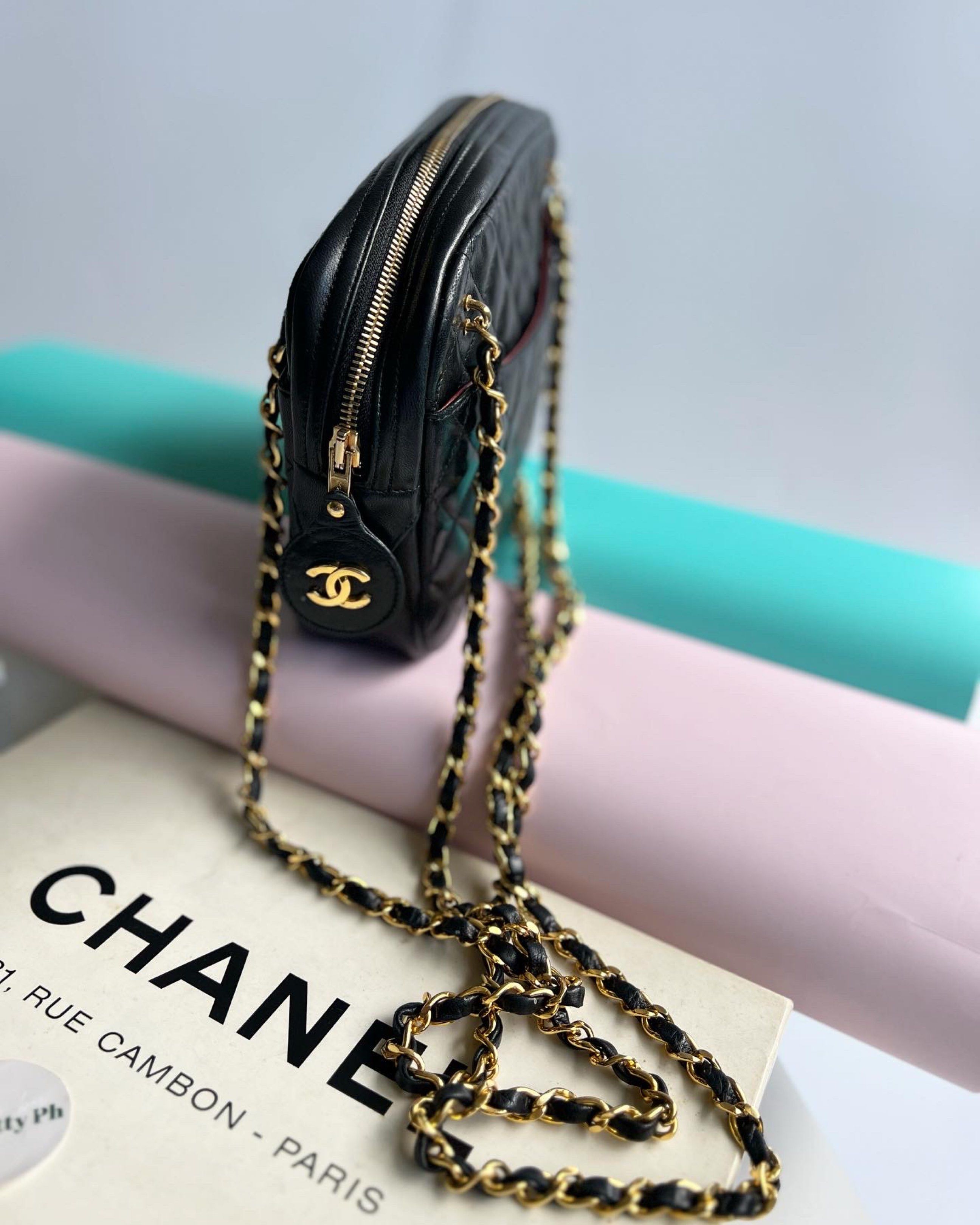 Authentic Preowned Chanel Quilted Camera Bag with double Chain strap (Category: Luxury Bags & Wallets) located in San Pablo. Submitted by misskittyph (Listing ID 1419781619, Image 2). Description: Vintage Black Chanel Quilted Lambskin Gold Chain Hardware Camera Shoulder Bag with CC Charm ▪️105k only Series 1xxxxxx 24k goldplated hardware With card, box, generic dustbag Serial sticker is intact 9/10 condition Interior with tolerable signs of use L
