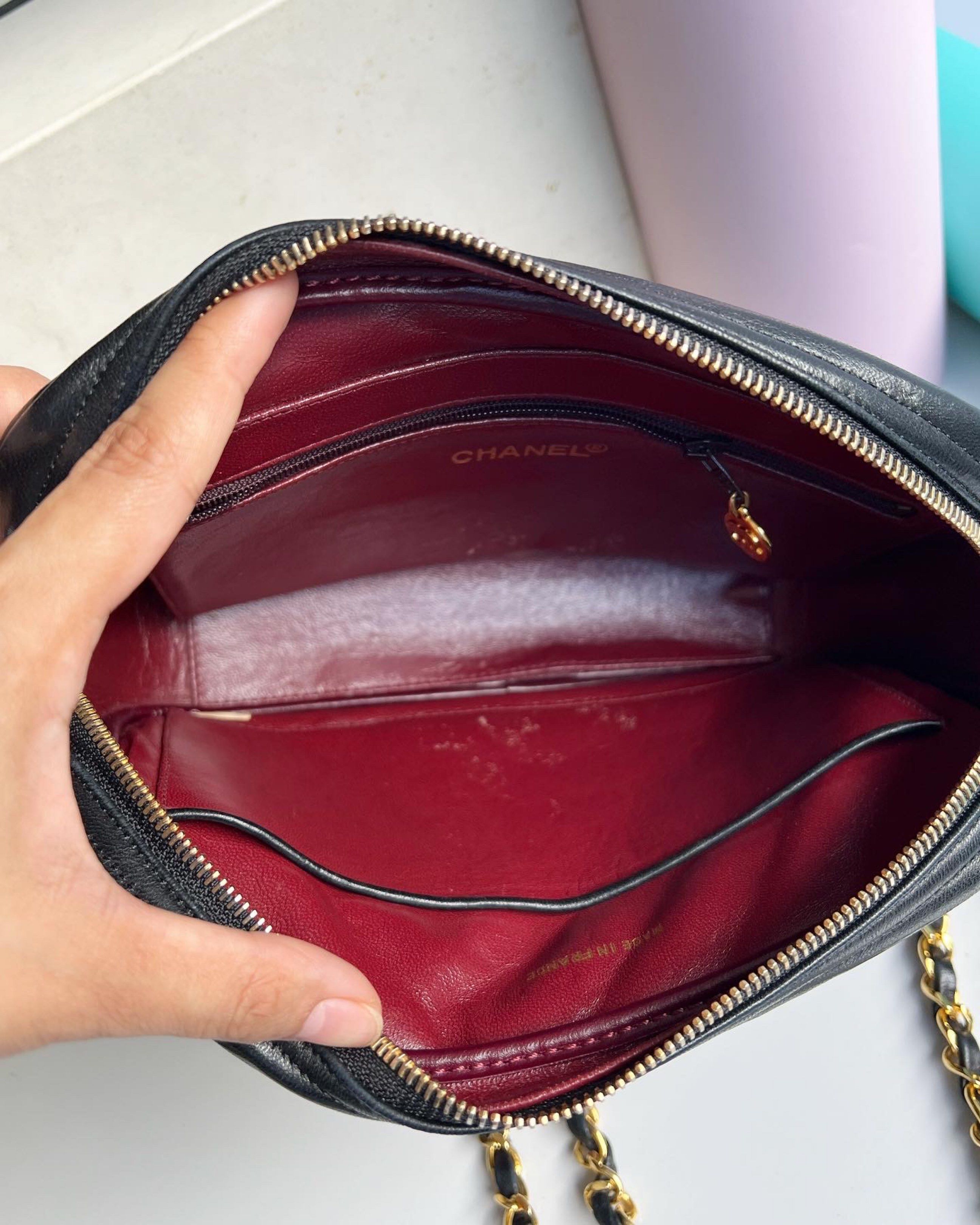 Authentic Preowned Chanel Quilted Camera Bag with double Chain strap (Category: Luxury Bags & Wallets) located in San Pablo. Submitted by misskittyph (Listing ID 1419781619, Image 3). Description: Vintage Black Chanel Quilted Lambskin Gold Chain Hardware Camera Shoulder Bag with CC Charm ▪️105k only Series 1xxxxxx 24k goldplated hardware With card, box, generic dustbag Serial sticker is intact 9/10 condition Interior with tolerable signs of use L