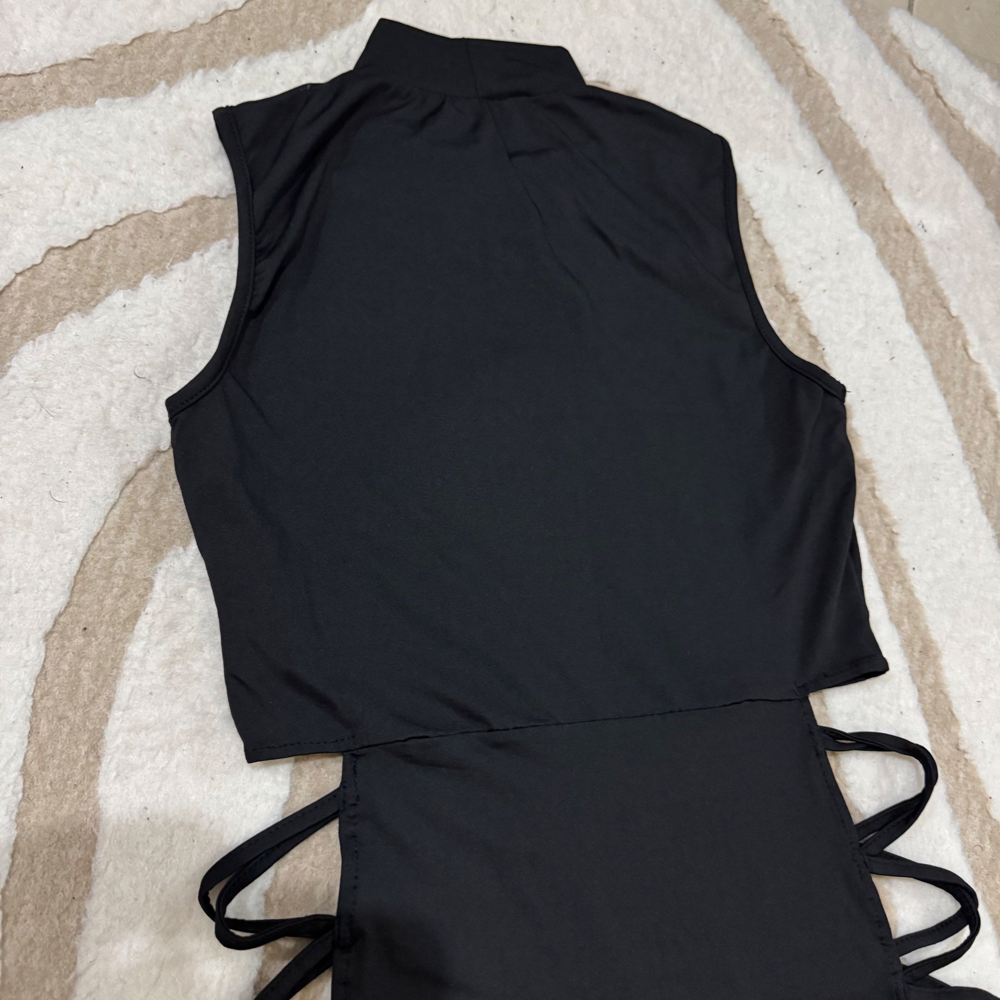 Black Cutout Maxi Dress (Category: Dresses) located in Makati City. Submitted by finders.keep.hers (Listing ID 1419842459, Image 3). Description: - Sleeveless black maxi dress - High neckline - Cutout detailing on sides - Made of stretchy material - Fitted silhouette - Ideal for nights out and special occasions.