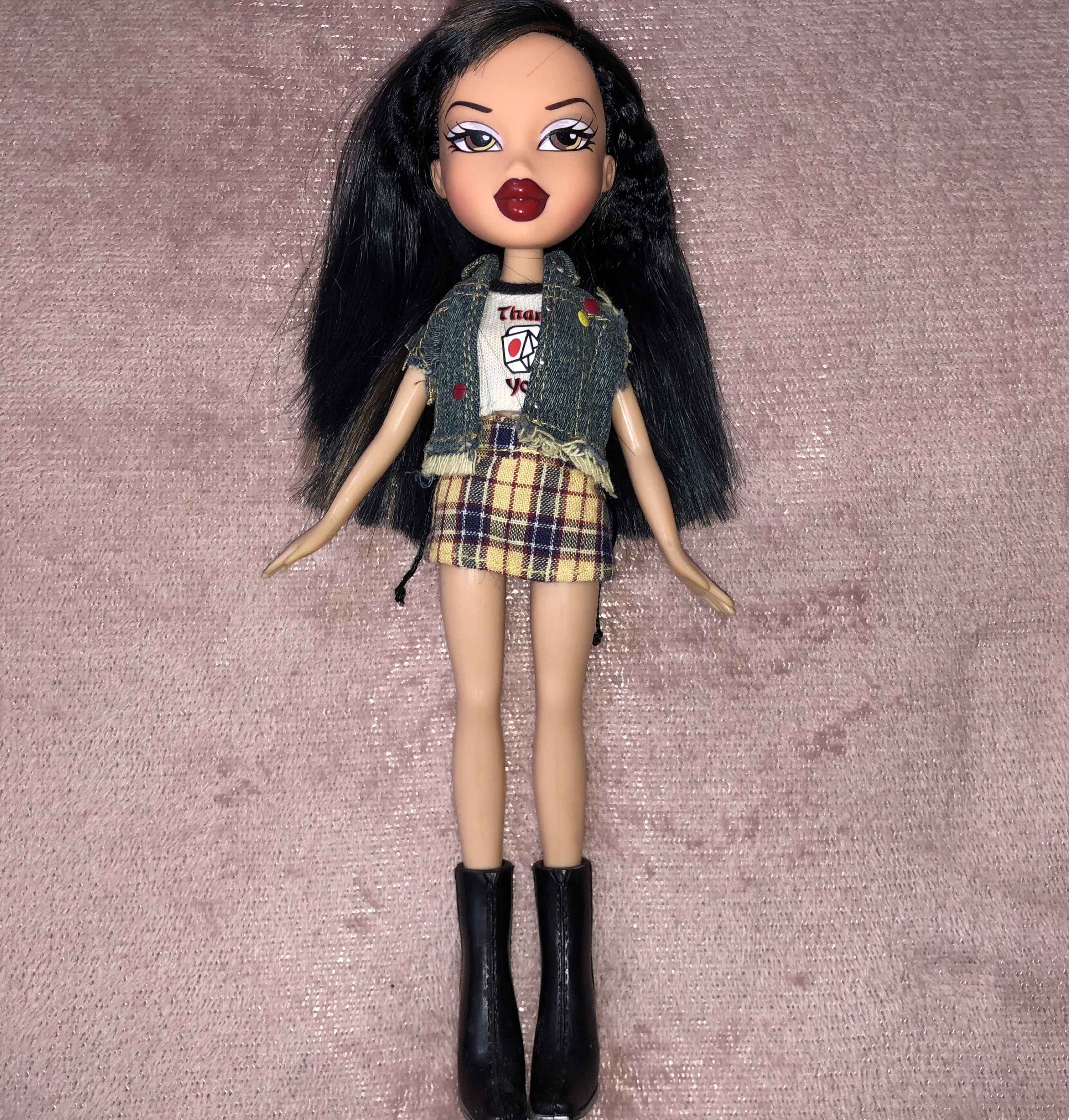 Bratz Style it Jade (Category: Kids Toys) located in Manila. Submitted by cheenamaure11483 (Listing ID 1419877544, Image 1). Description: Bratz Style it Jade -Wearing original outfit -No issues, No scratches -In good Conditon - Long black hair - Denim vest - Plaid skirt - White shirt with graphic print - Black boots - Brown eyes - Red lipstick Shipping Method: Lalamove & Jnt Payment Method: Gcash & BDO DM/PM for more info🙂 .
