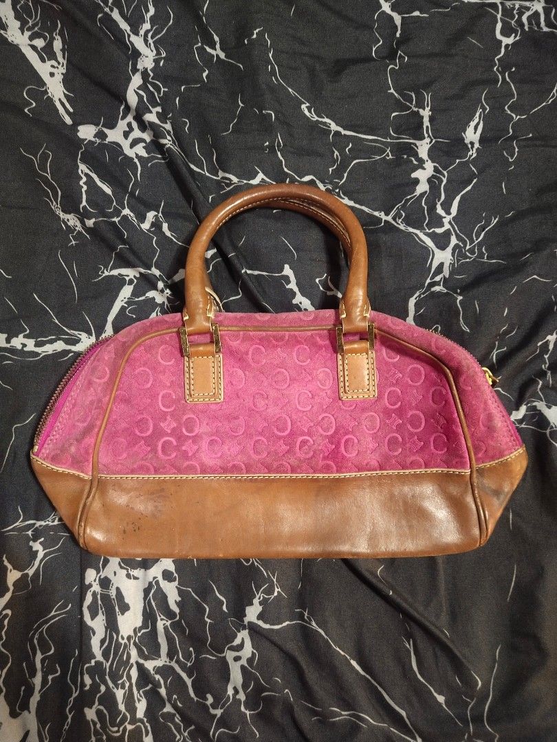 Celine Pink and Brown Handbag (Category: Luxury Bags & Wallets) located in Quezon City. Submitted by emerson.lachica (Listing ID 1419816344, Image 2). Description: - Authentic Celine handbag - Pink suede body with repeating logo pattern - Brown leather accents - Top zipper closure - Dual handles - Light beige interior lining - Gold-toned hardware - Marked "CELINE" and "MADE IN ITALY".