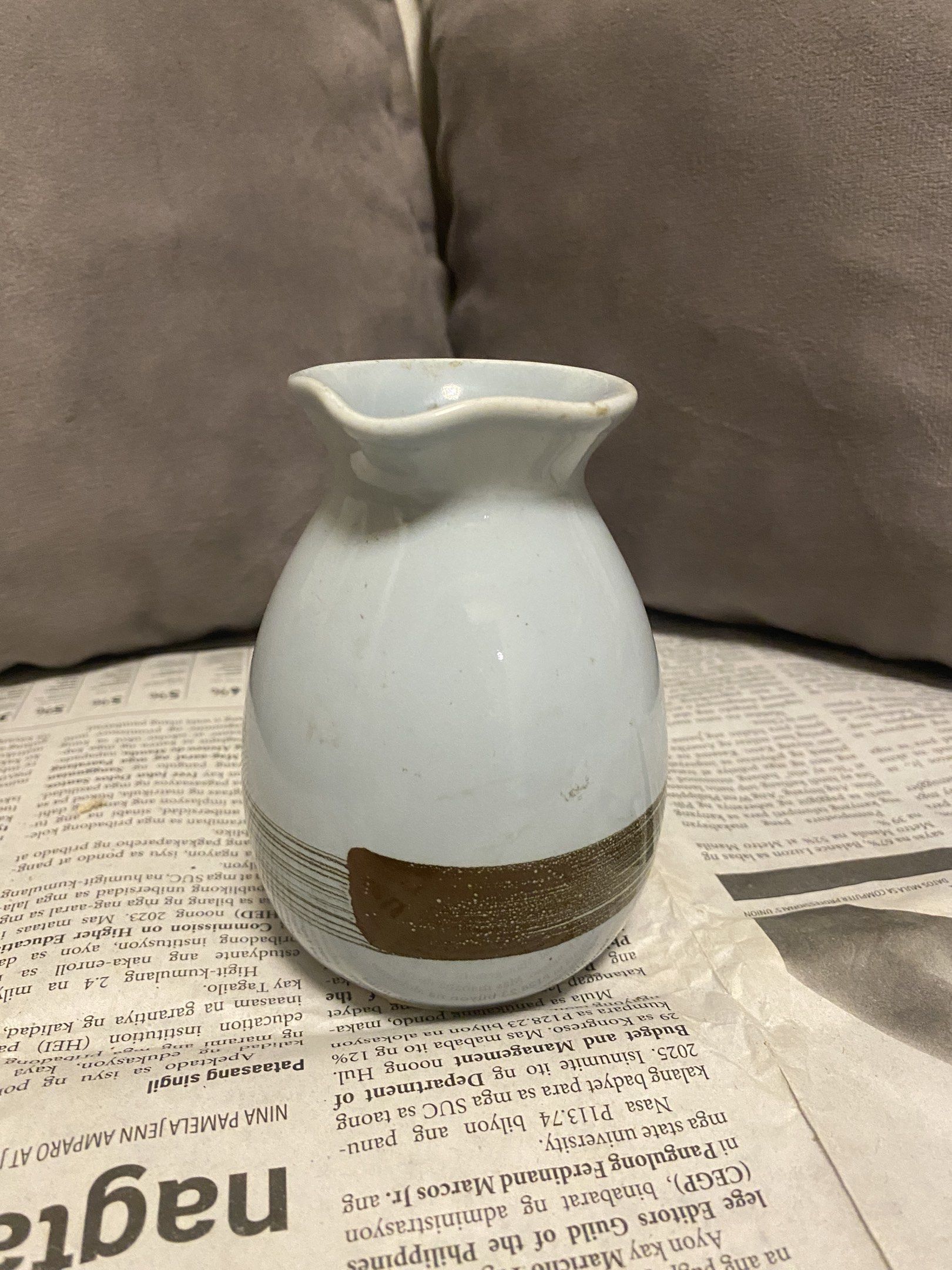Ceramic Sake Pitcher/Pouring Vase and Bowls Set (Category: Dinnerware & Cutlery) located in Rizal. Submitted by chm.ab (Listing ID 1419958810, Image 1). Description: - Ceramic sake set - Includes pitcher and 4 bowls - Unique pitcher shape with spout - with brown stripe brush stroke design - Ideal for serving sake or other beverages - Stylish addition to your home bar - Pwede pang sake, sauce pouring, or small dried flowers. • sold per piece/ set 