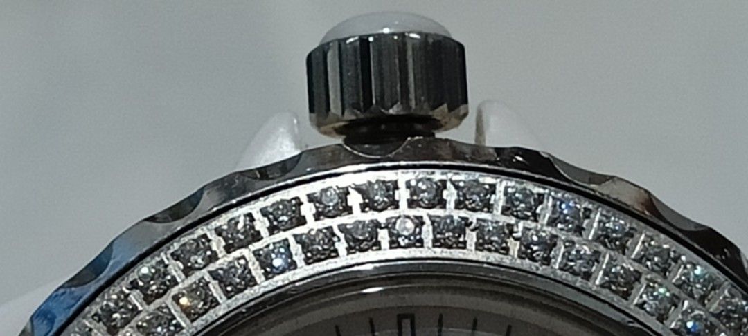 Chanel J12 Diamond Bezel White Ceramic Watch (Category: Luxury Watches) located in Baguio. Submitted by khailyjhotheatro18 (Listing ID 1419921279, Image 3). Description: - Chanel J12 watch - White ceramic bracelet and case - Diamond-encrusted bezel - White dial with black hands and numerals - Date display at 3 o'clock - Butterfly clasp - Marked with Chanel Paris on the back.