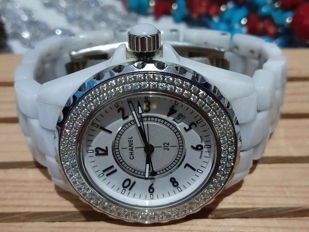 Chanel J12 Diamond Bezel White Ceramic Watch (Category: Luxury Watches) located in Baguio. Submitted by khailyjhotheatro18 (Listing ID 1419921279, Image 1). Description: - Chanel J12 watch - White ceramic bracelet and case - Diamond-encrusted bezel - White dial with black hands and numerals - Date display at 3 o'clock - Butterfly clasp - Marked with Chanel Paris on the back.