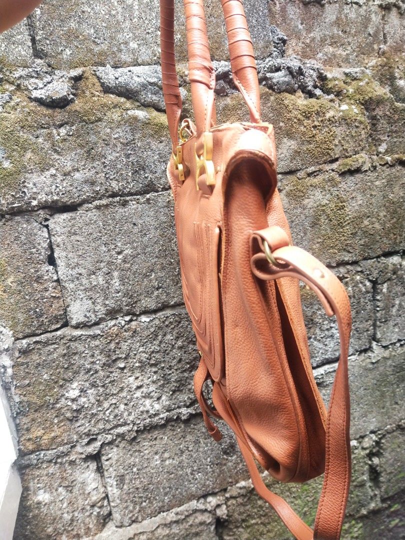 Chloe Marcie Leather Handbag (Category: Luxury Bags & Wallets) located in Quezon City. Submitted by emerson.lachica (Listing ID 1419816212, Image 3). Description: - Chloe Marcie handbag - Color: Brown - Features: - Top handle - Detachable shoulder strap - Flap closure with tassel - Includes Chloe tags - Interior lining: Black - Gold-tone hardware - Chloe logo embossed on leather.