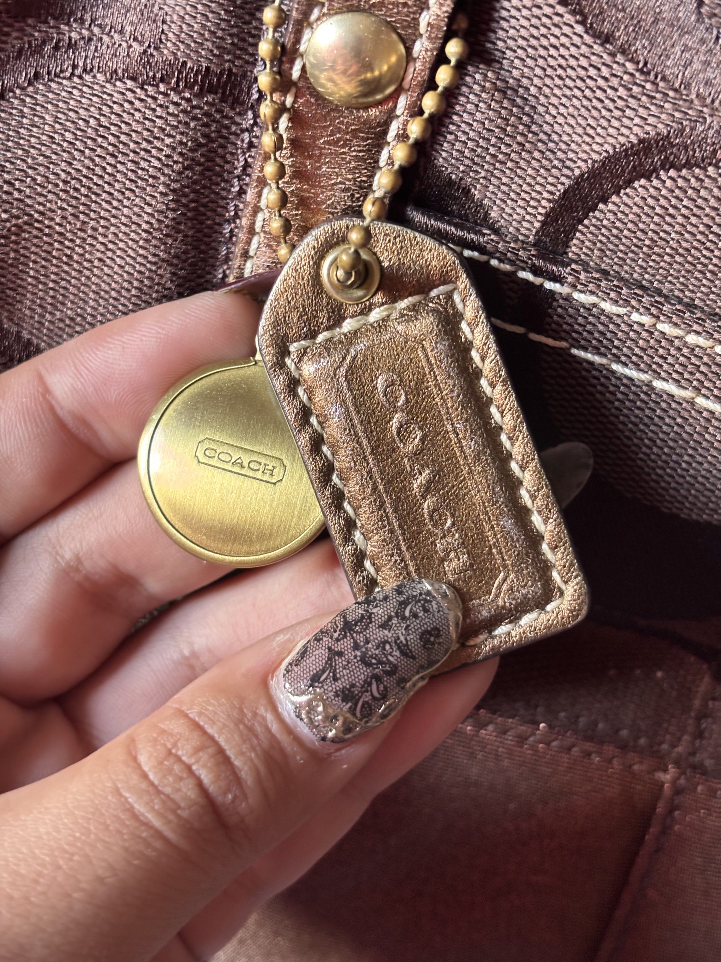 Coach Brown Boston Satchel Handbag (Category: Luxury Bags & Wallets) located in Paranaque City. Submitted by lovedbydevi (Listing ID 1419892558, Image 3). Description: fs: coach boston bag in chocolate brown slightly nego overall good condition with hangtag malinis loob minor issues: slight fading sa metallic parts open for vc.