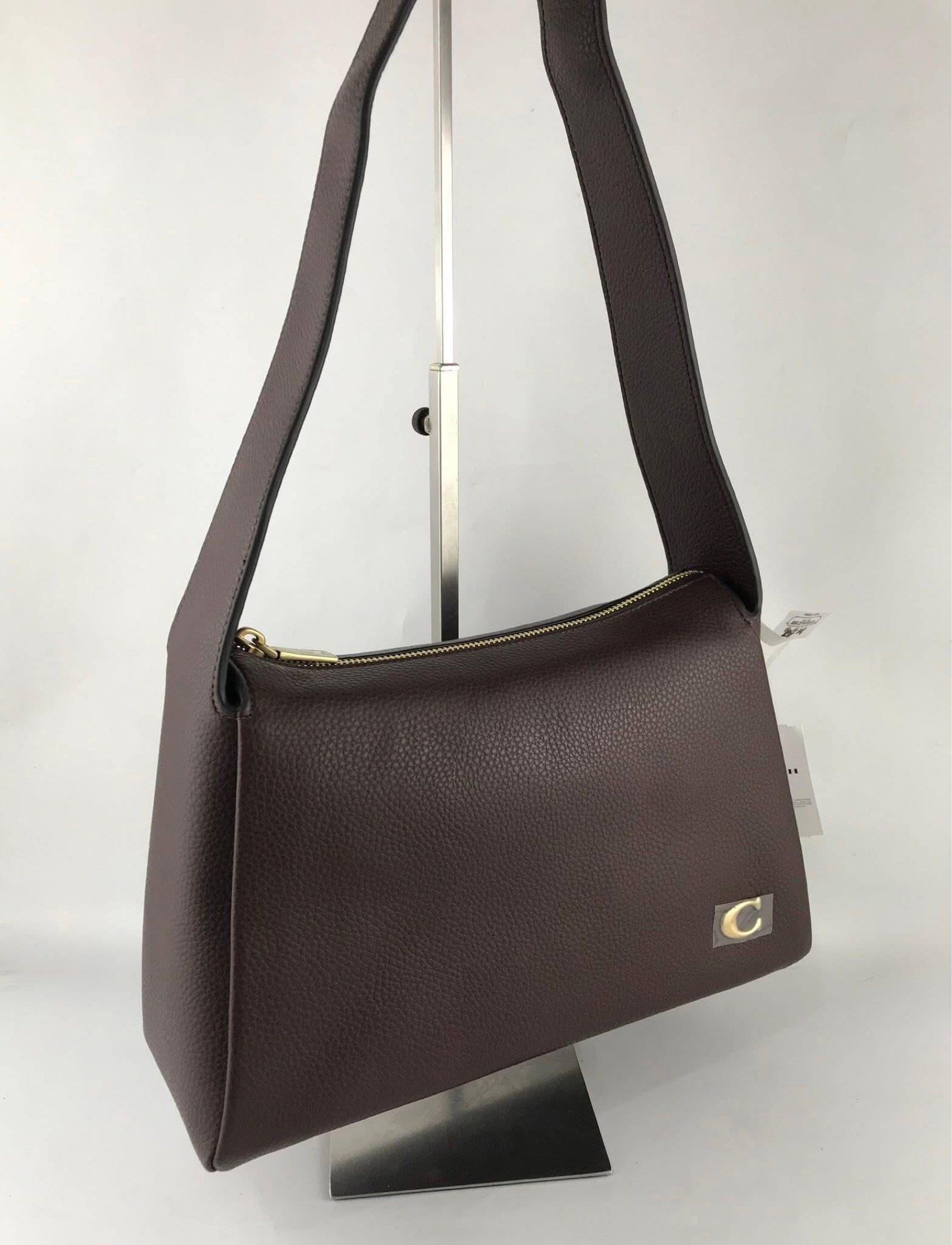 Coach Lola Shoulder Bag in Brass/Maple (Category: Shoulder Bags) located in Marikina City. Submitted by smthxtra (Listing ID 1419873725, Image 2). Description: Length: 11.5” Height: 7.25” Width: 4.0” Handle with 10.5” drop Inside snap pocket Zip-top closure With tag, care card, dust bag, and paper bag included.