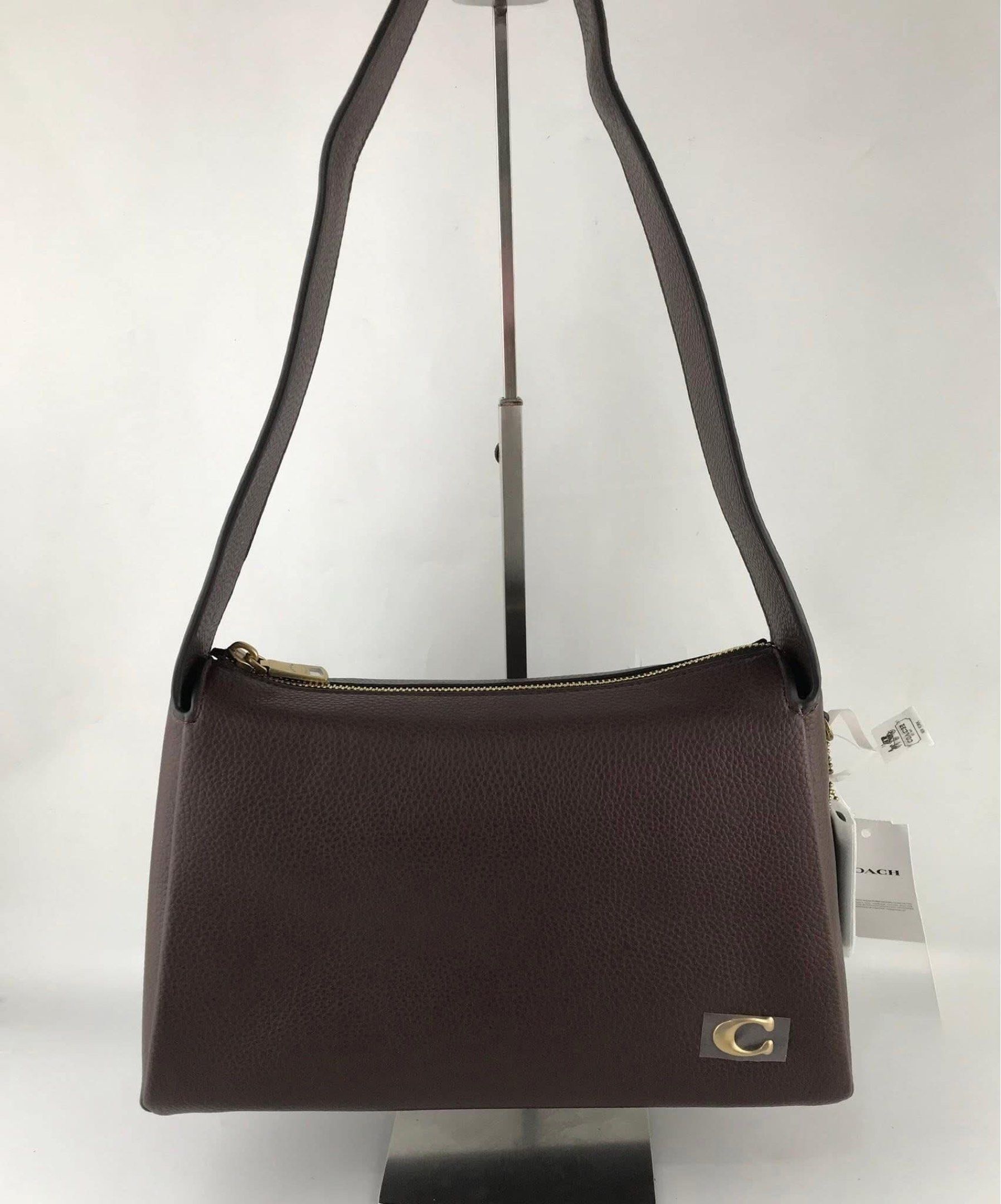 Coach Lola Shoulder Bag in Brass/Maple (Category: Shoulder Bags) located in Marikina City. Submitted by smthxtra (Listing ID 1419873725, Image 3). Description: Length: 11.5” Height: 7.25” Width: 4.0” Handle with 10.5” drop Inside snap pocket Zip-top closure With tag, care card, dust bag, and paper bag included.