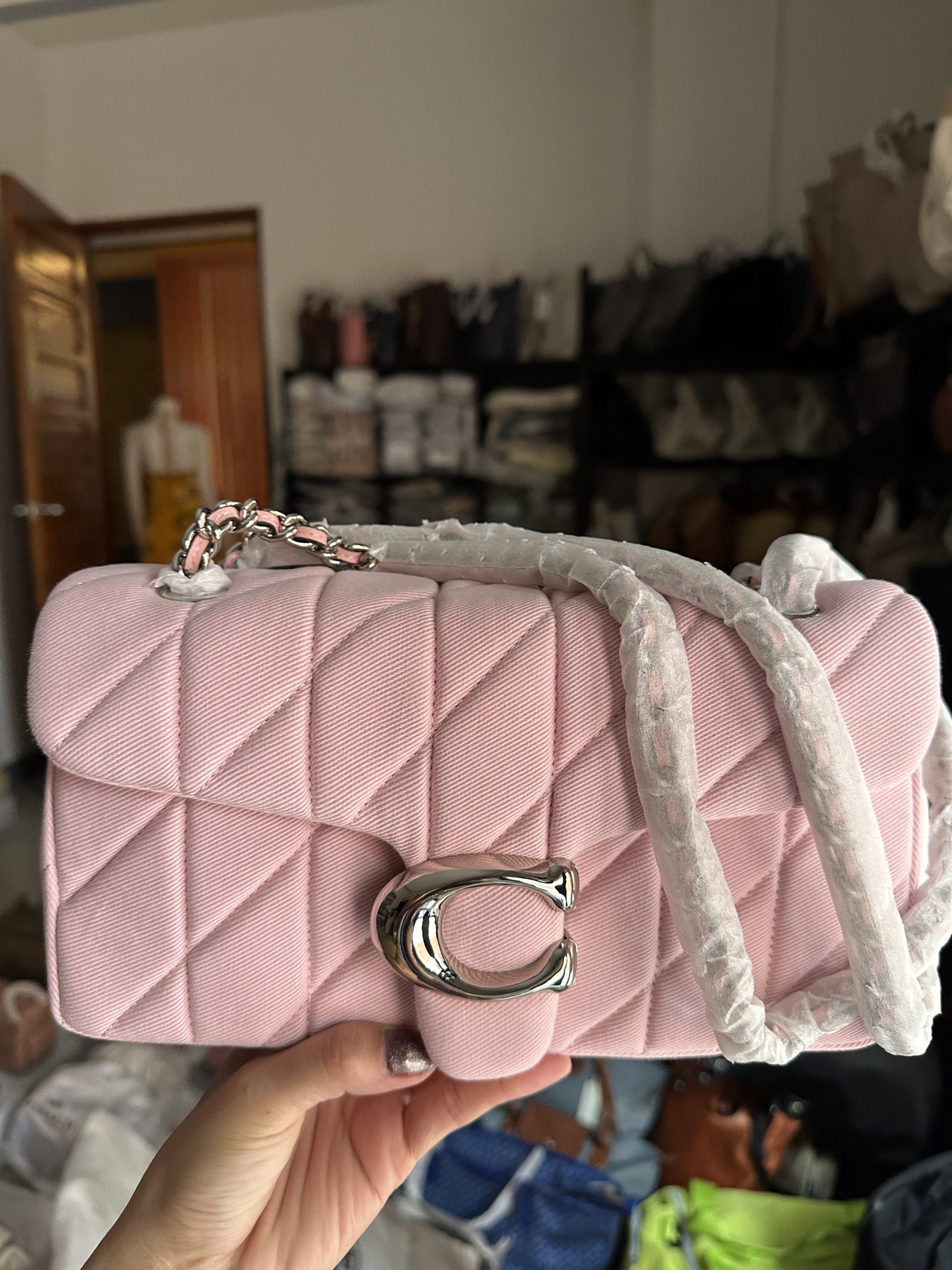 Coach Pillow Tabby Shoulder Bag (Category: Luxury Bags & Wallets) located in Manila. Submitted by mabssy-2000 (Listing ID 1419928278, Image 2). Description: - Brand new Coach Pillow Tabby shoulder bag - Light pink color - Quilted design - Silver-tone 'C' clasp - Chain strap - Includes dust bag - Comes with original strap - Unused condition.