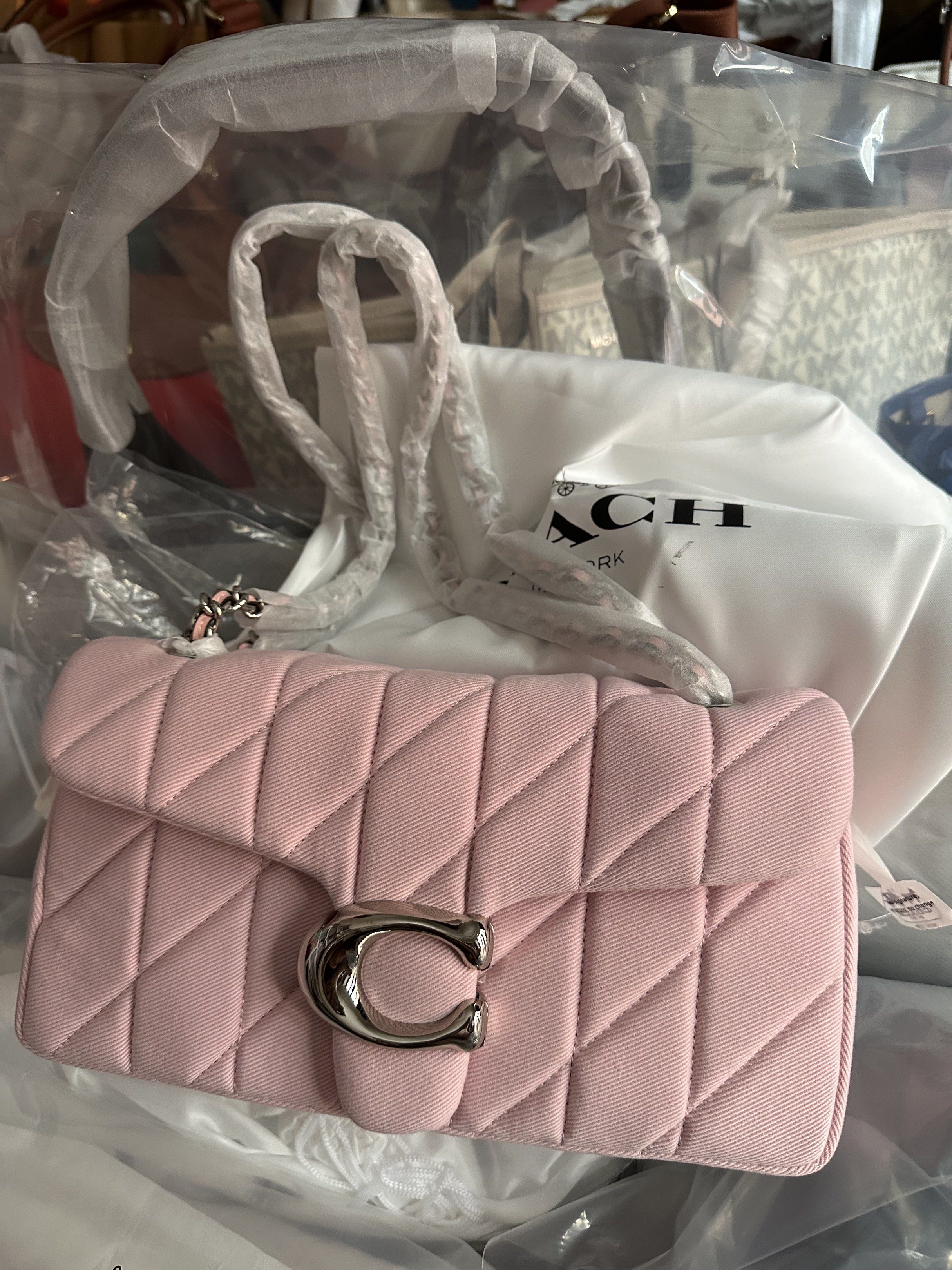 Coach Pillow Tabby Shoulder Bag (Category: Luxury Bags & Wallets) located in Manila. Submitted by mabssy-2000 (Listing ID 1419928278, Image 1). Description: - Brand new Coach Pillow Tabby shoulder bag - Light pink color - Quilted design - Silver-tone 'C' clasp - Chain strap - Includes dust bag - Comes with original strap - Unused condition.