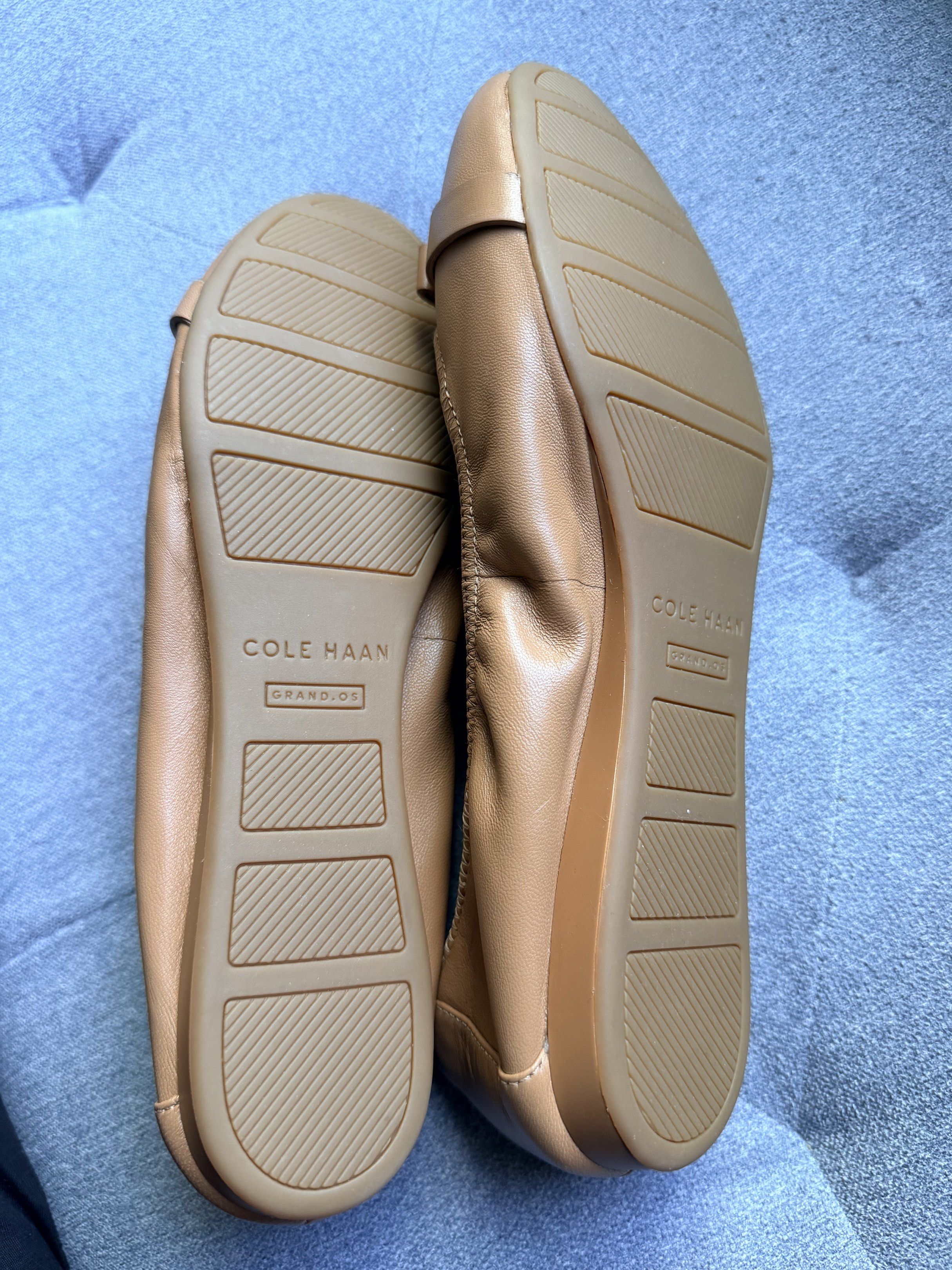 Cole Haan GrandOS Leather Flats - Tan (Category: Flats & Sandals) located in Quezon City. Submitted by onna.kaizen (Listing ID 1419788331, Image 2). Description: - Cole Haan GrandOS leather flats - Color: Tan - Size: 8B - Made in Vietnam - Features bow detail with gold-tone hardware - GrandOS technology soles - Leather and manmade lining - Unworn condition - Includes original shoe trees.