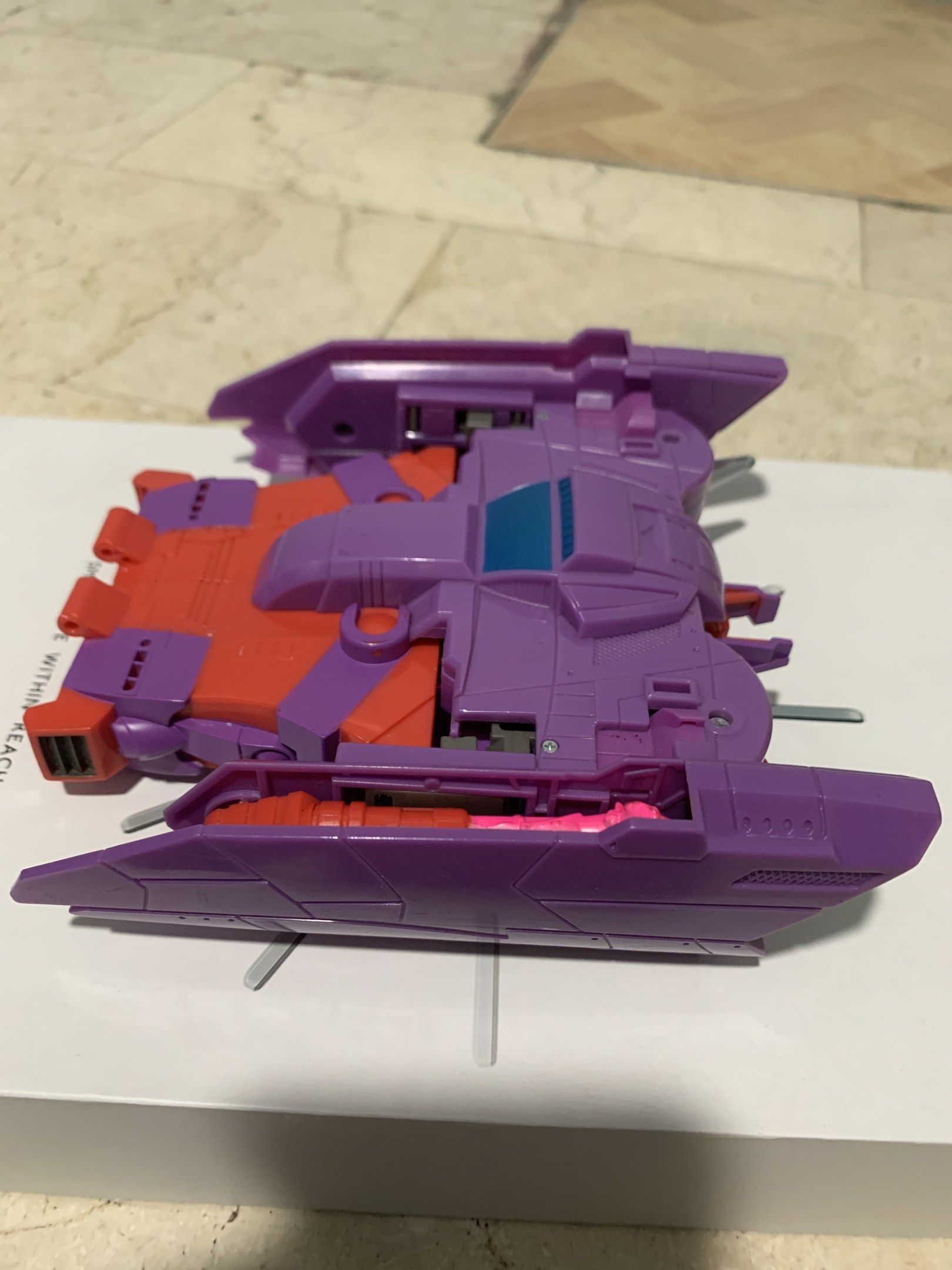 Cybertron Transformers Alpha Trion (Category: Action & Battle Toys) located in Valenzuela. Submitted by rjtoysjapan0306 (Listing ID 1419904952, Image 2). Description: ‼️‼️Sale Sale Sale ‼️‼️ Cybertron Alpha Trion Original Hasbro -7 inches - Transformers Armada Thrust figure - Transforms between jet and robot modes - Features a purple and red color scheme - Robot mode has a distinctive head design with a long, white face and silver accents - Jet m