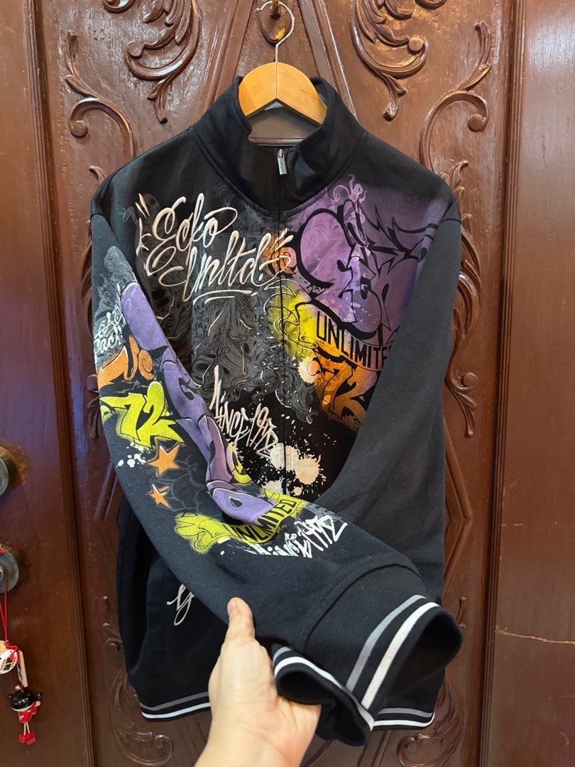 Ecko Unltd. Zip-Up Jacket - Black (Category: Coats, Jackets and Outerwear) located in Manila. Submitted by weart (Listing ID 1419952861, Image 2). Description: - Ecko Unltd. zip-up jacket - Size: M - Unique graphic design - Black base color with colorful accents - Zip closure - High collar - White stripe detail on cuffs Width - 24 Length - 30 📩Dm me if you got questions📩 What u see is what u get Samplaoc, Manila Pick up Orange house.