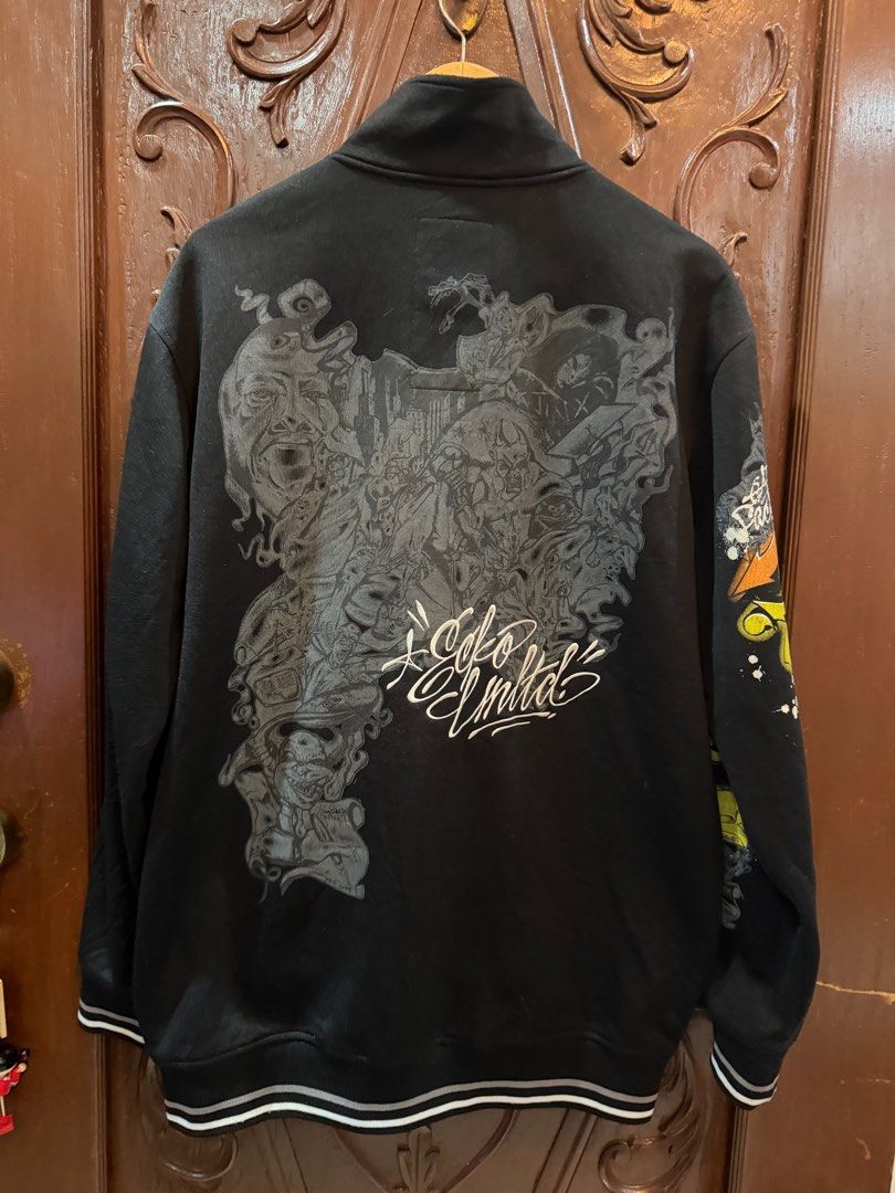 Ecko Unltd. Zip-Up Jacket - Black (Category: Coats, Jackets and Outerwear) located in Manila. Submitted by weart (Listing ID 1419952861, Image 3). Description: - Ecko Unltd. zip-up jacket - Size: M - Unique graphic design - Black base color with colorful accents - Zip closure - High collar - White stripe detail on cuffs Width - 24 Length - 30 📩Dm me if you got questions📩 What u see is what u get Samplaoc, Manila Pick up Orange house.