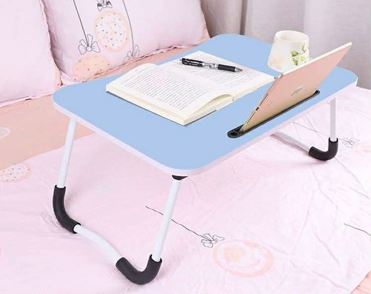 Foldable Laptop Table 30x50cm (Category: Tables & Sets) located in Manila. Submitted by yzlshop (Listing ID 1419862487, Image 3). Description: - Foldable laptop table for comfortable work/study. - Ideal for bed or couch use. - Includes a slot for tablets/phones. - Smooth surface for writing. - Legs fold for easy storage. - Available in multiple colors..