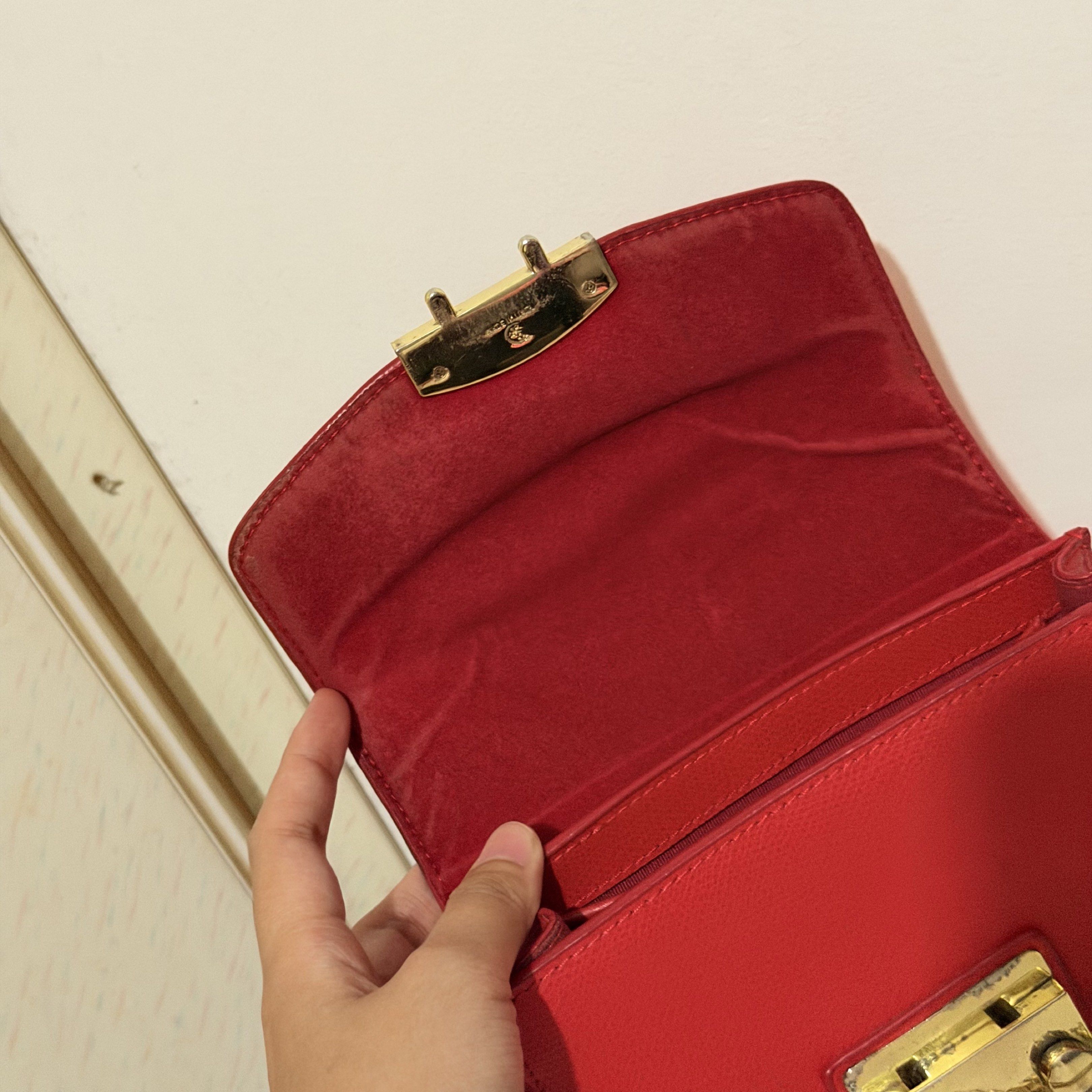 Furla Red Sling Bag (Category: Luxury Bags & Wallets) located in Pasig City. Submitted by decluttertrends (Listing ID 1419801595, Image 2). Description: -used but not abused -w/ minimal signs of usage please manage expectations.