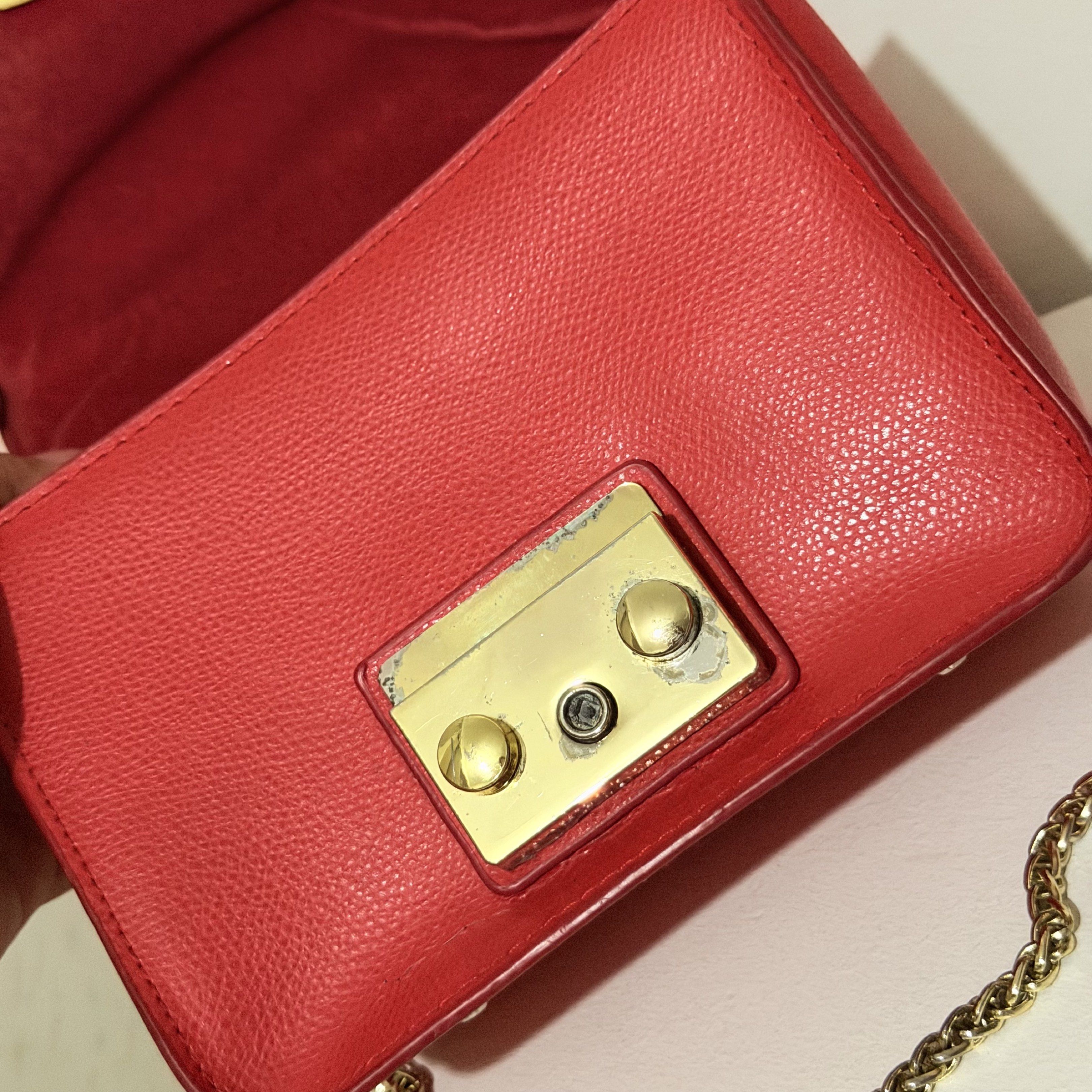 Furla Red Sling Bag (Category: Luxury Bags & Wallets) located in Pasig City. Submitted by decluttertrends (Listing ID 1419801595, Image 3). Description: -used but not abused -w/ minimal signs of usage please manage expectations.