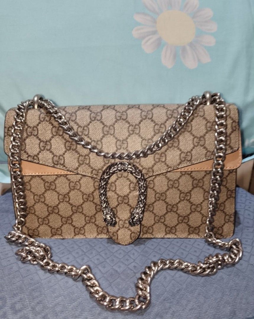 Gucci Dionysus Shoulder Bag (Category: Luxury Bags & Wallets) located in San Juan City. Submitted by cheryl20624 (Listing ID 1419816542, Image 3). Description: - Auth Gucci Dionysus bag - Iconic GG Supreme canvas - Silver-tone chain strap - Signature tiger head closure - Beige leather trim - Spacious interior - Perfect for any occasion.