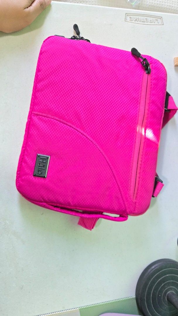 Halo Tablet Bag - Pink (Category: Laptop Bags & Sleeves) located in San Mateo. Submitted by realmeljorie (Listing ID 1419844550, Image 1). Description: - Pink tablet bag - Size: 10"x8" - Zippered main compartment - Front zippered pocket - Adjustable straps and handle - 'Halo' logo - Padded interior for protection - Made of durable, textured material.