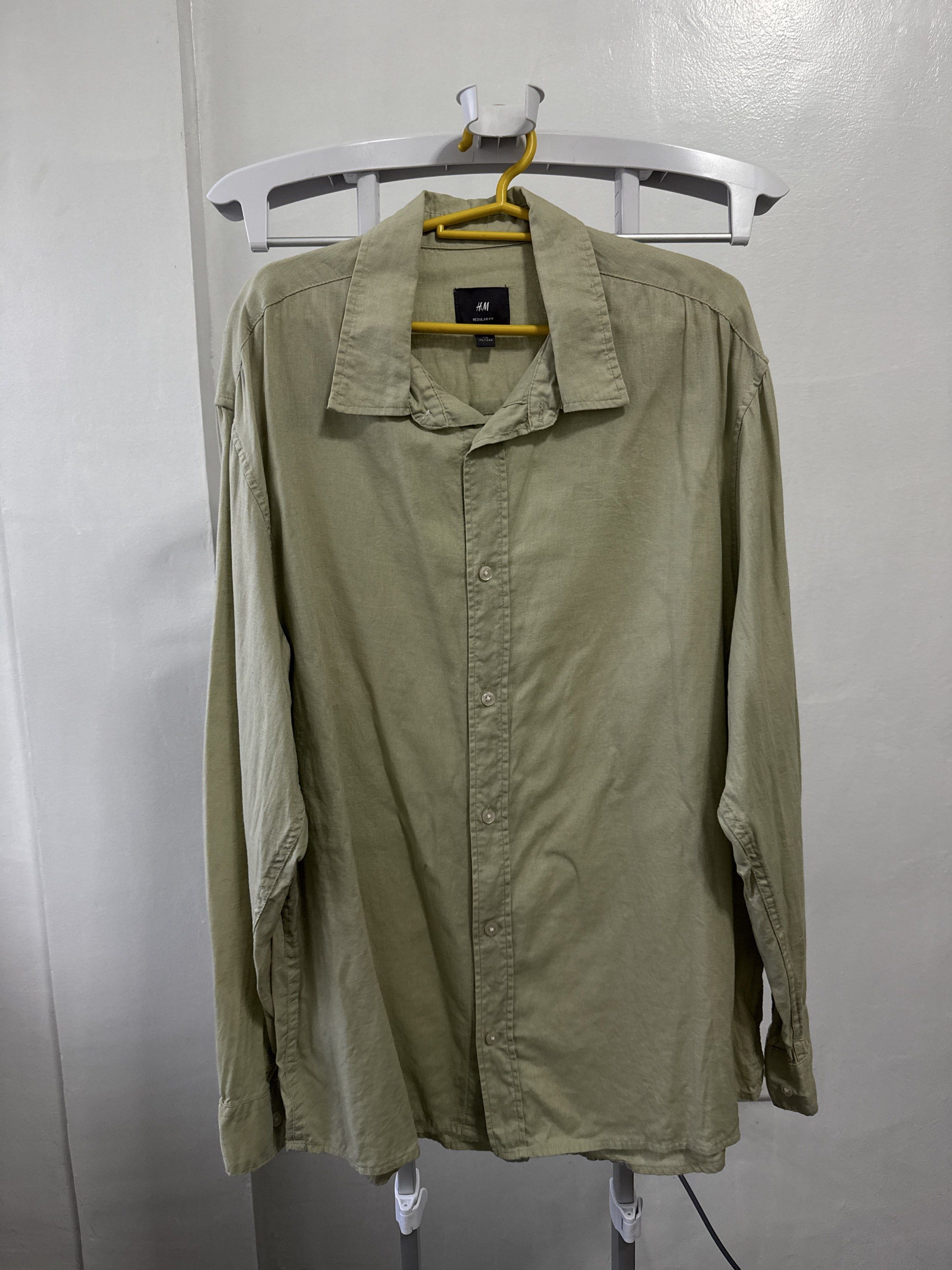 H&M Long Sleeve Shirt (Category: Tshirts & Polo Shirts ) located in Quezon City. Submitted by trumangelo (Listing ID 1419822174, Image 1). Description: - H&M long sleeve shirt - Light green color - Button-down front - Classic collar - Lightweight fabric - Ideal for casual wear No issues Ships via Gogoxpress or same day delivery (Lalamove or Grab).