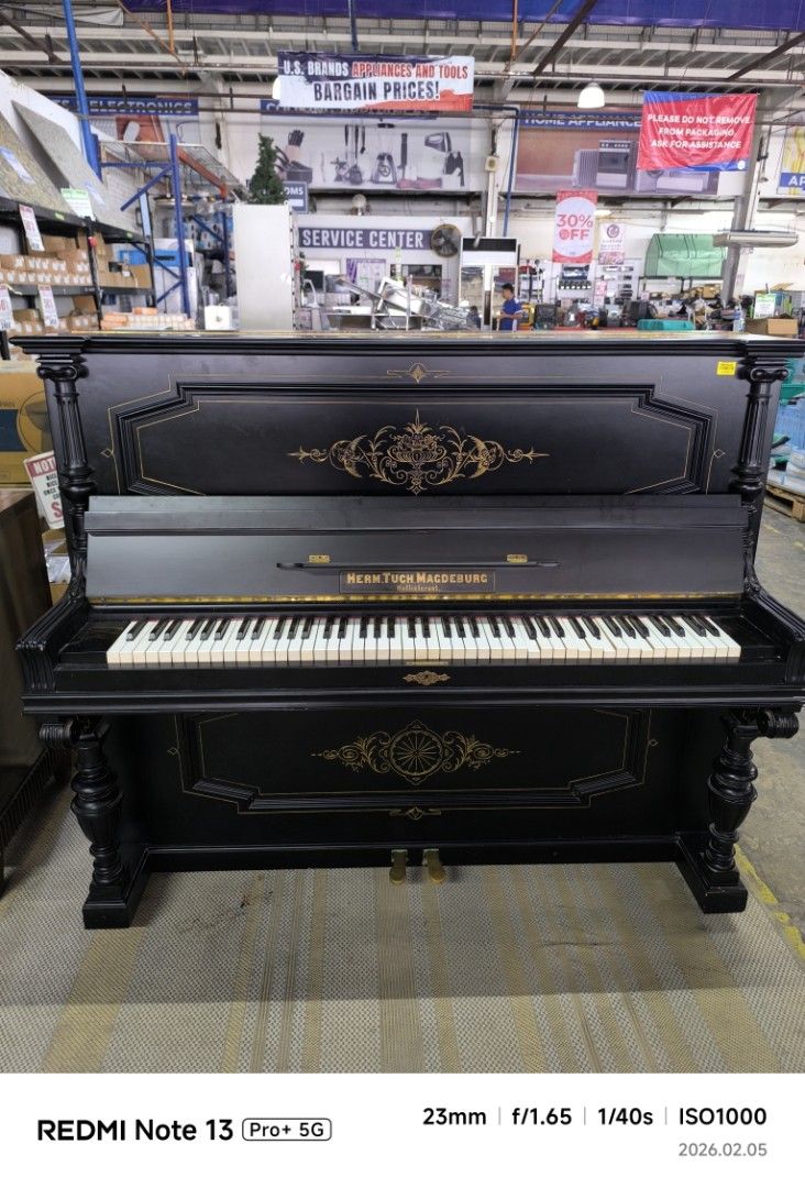 Hoflieferant Piano - Black (Category: Musical Instruments) located in Dasmarinas. Submitted by bossgabo (Listing ID 1419852826, Image 1). Description: - Elegant black piano - Full keyboard with white and black keys - Decorative gold accents - Classic design with ornate legs and detailing - Features two pedals.