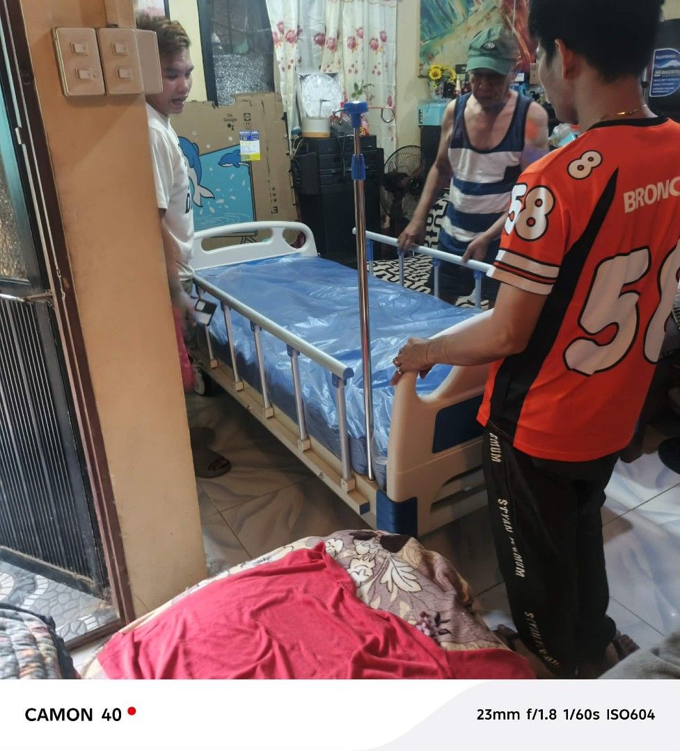 Hospital Bed with IV Stand (Category: Medical Supplies & Tools) located in Manila. Submitted by joy63057743416 (Listing ID 1419786138, Image 1). Description: - Hospital bed with blue mattress cover - Includes IV stand - Metal frame with blue and white accents.