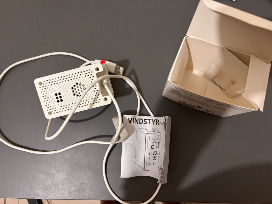 IKEA VINDSYRKA Smart Air Quality Sensor (Category: Home Improvement Tools & Accessories) located in Makati City. Submitted by capitalistbear (Listing ID 1419929742, Image 2). Description: IKEA VINDSYRKA air quality sensor. Includes the sensor unit, USB cable, and original packaging. The sensor displays temperature, humidity, and air quality readings. It has a white body with a digital display. You will need an ikea smart hub for this unless you h