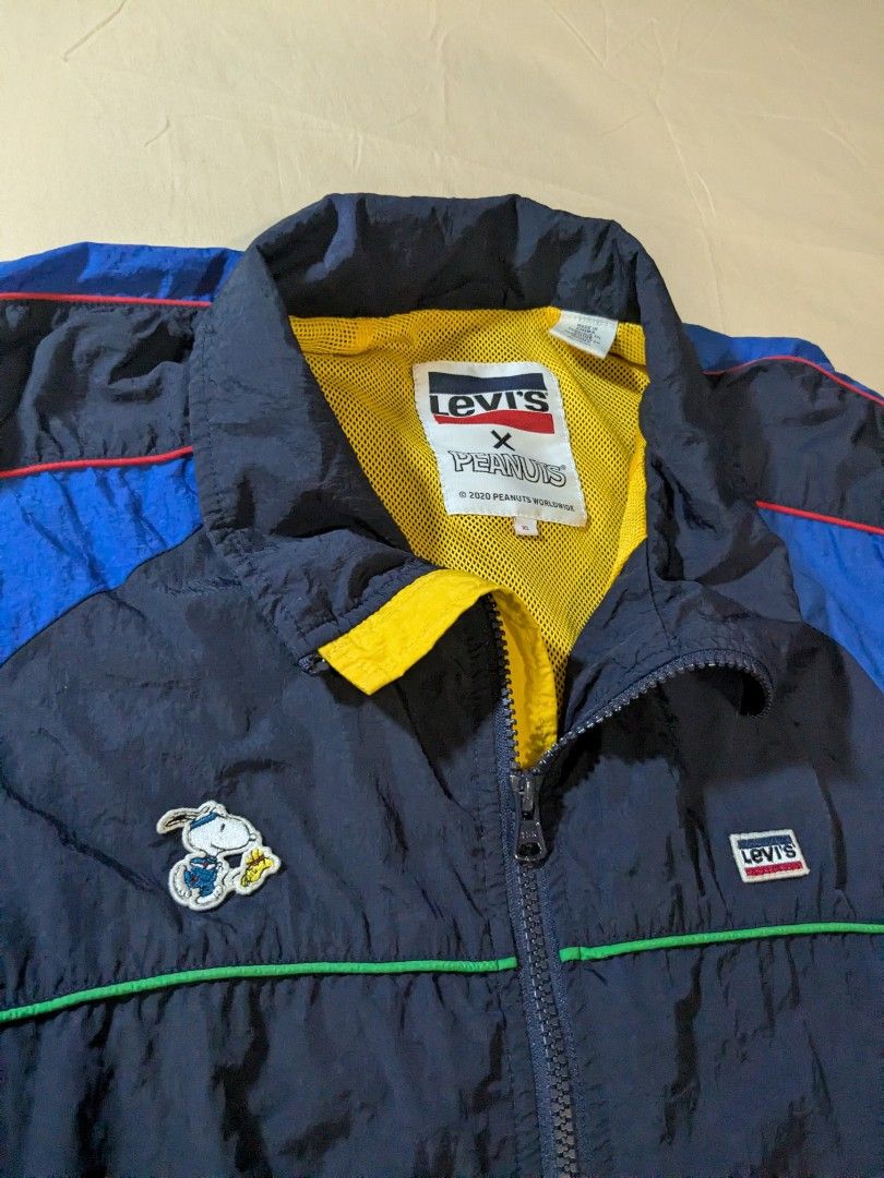 Levi's x Peanuts Windbreaker Jacket - XL (Category: Coats, Jackets and Outerwear) located in Quezon City. Submitted by frankmountain (Listing ID 1419930543, Image 1). Description: - Levi's x Peanuts Vintage Windbreaker Jacket - Excellent condition. Barely used. No issues - Color: Navy Blue, Yellow, and Blue - Design: Snoopy patch - Features: Full zipper closure, Levi's logo patch - Size: XL - Origin: Made in China.