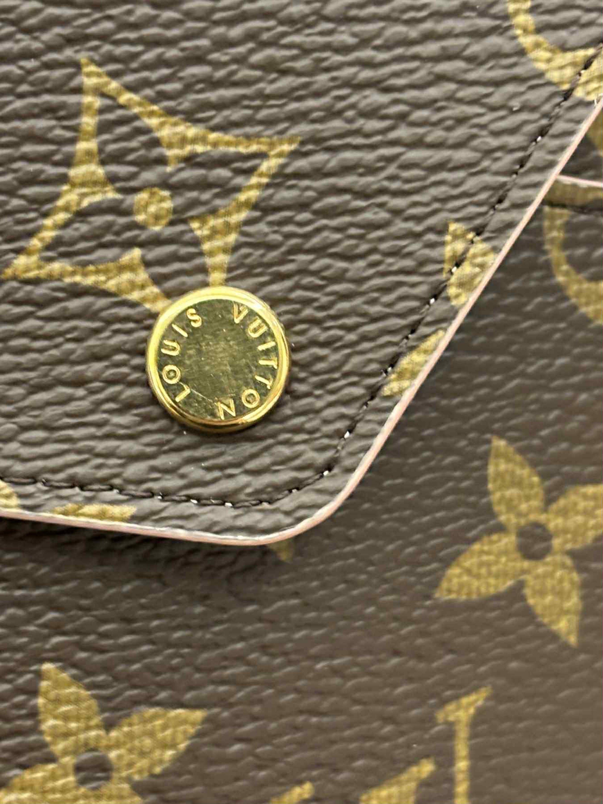 Louis Vuitton Kirigami Envelope Pouch (Category: Luxury Bags & Wallets) located in Makati City. Submitted by vanessacaeg_ (Listing ID 1419878418, Image 3). Description: RFS: Decluttering Like New/Unused, so might as well pass them on to someone who will - Authentic Louis Vuitton clutch - Iconic monogram pattern - Flap closure with gold-tone button - Light pink interior - Comes with original box, dust bag, and cards .