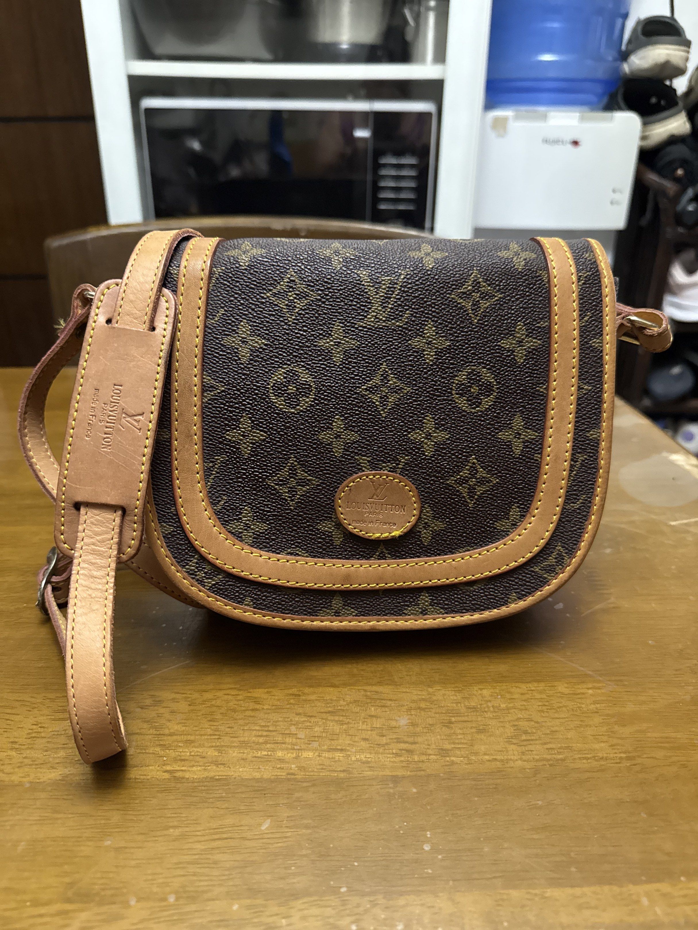 Louis Vuitton Monogram Crossbody Bag (Category: Luxury Bags & Wallets) located in Pilar. Submitted by faveanyshop (Listing ID 1419856645, Image 1). Description: - Authentic Louis Vuitton crossbody bag - Classic monogram canvas - Flap closure with gold-tone push lock - Adjustable leather shoulder strap - Interior: main compartment and zippered pocket - Made in France.