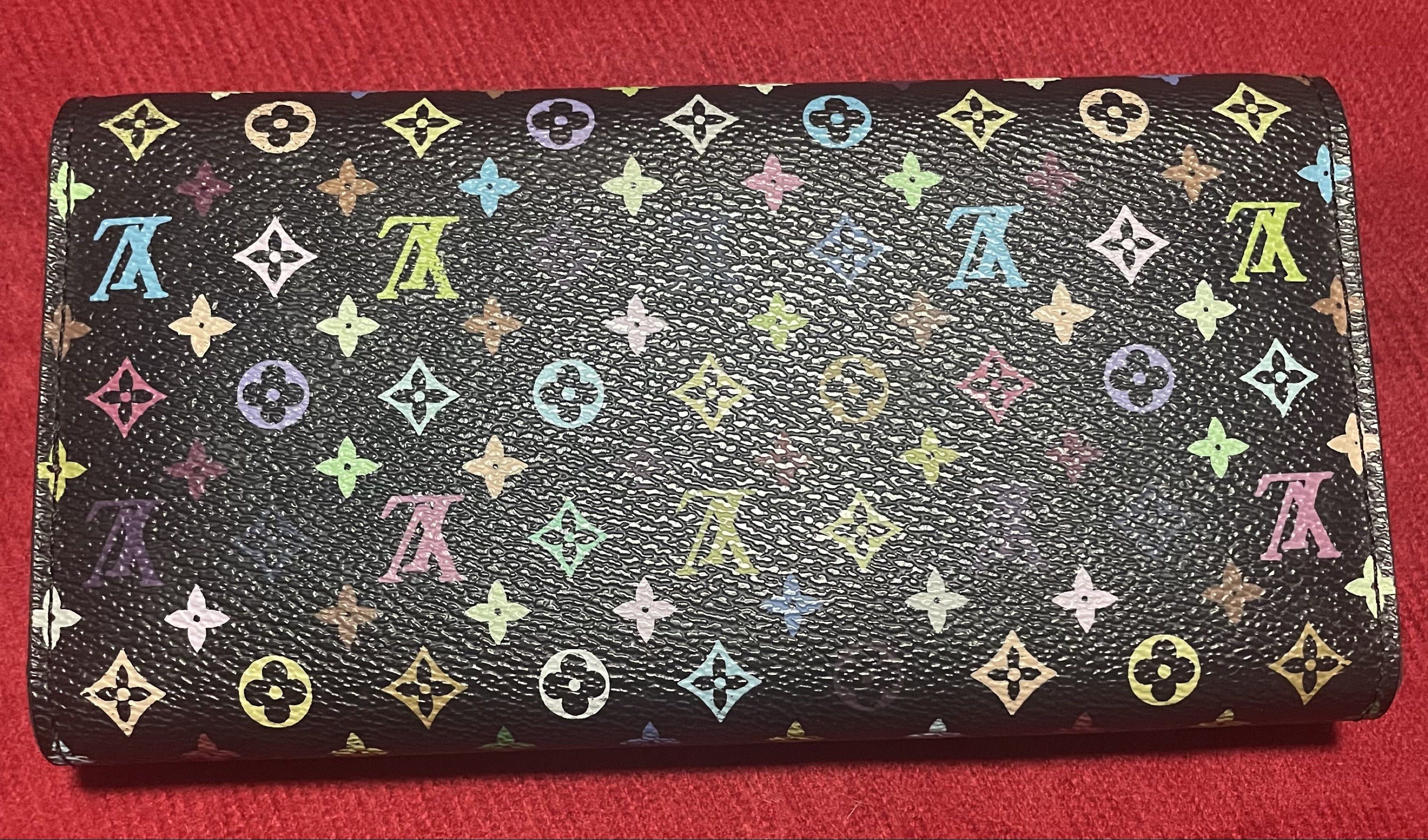 Louis Vuitton Multicolor Sarah Wallet (Category: Luxury Bags & Wallets) located in Quezon City. Submitted by marge04 (Listing ID 1419822119, Image 2). Description: - Authentic Louis Vuitton Sarah Wallet - Multicolor design - Black exterior with colorful LV monogram - Pink interior - Multiple card slots - Zippered compartment - Snap closure with LV logo issue details in photos.
