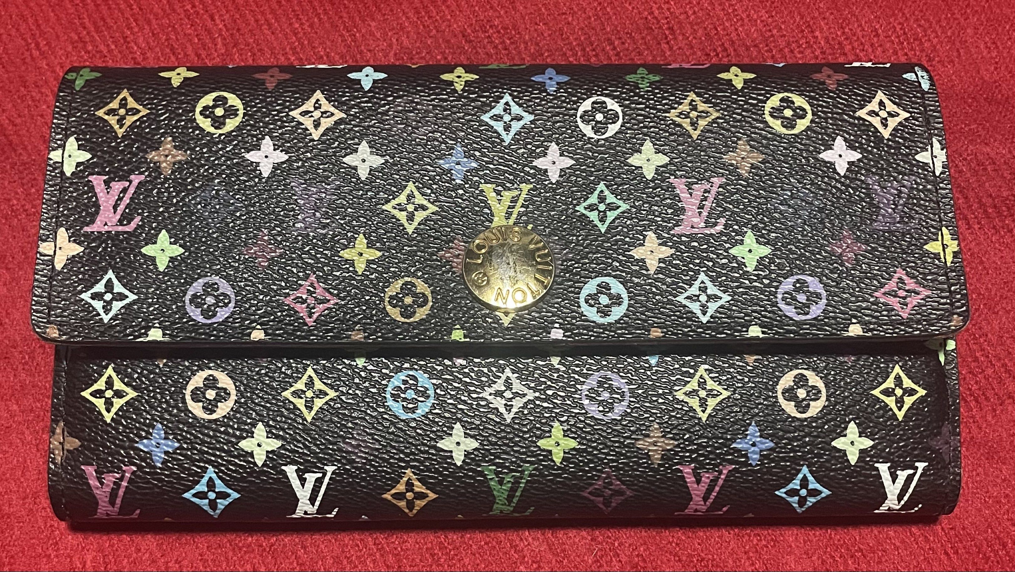 Louis Vuitton Multicolor Sarah Wallet (Category: Luxury Bags & Wallets) located in Quezon City. Submitted by marge04 (Listing ID 1419822119, Image 1). Description: - Authentic Louis Vuitton Sarah Wallet - Multicolor design - Black exterior with colorful LV monogram - Pink interior - Multiple card slots - Zippered compartment - Snap closure with LV logo issue details in photos.