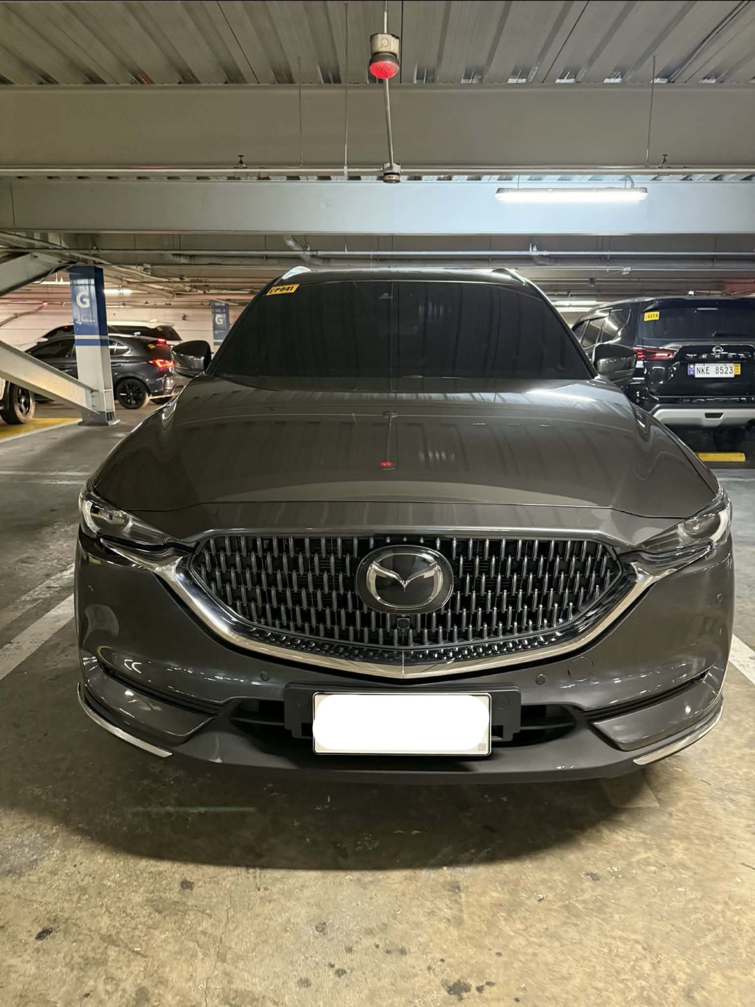 Mazda CX-8 Exclusive Auto (Category: Used Cars) located in Manila. Submitted by ennui242526 (Listing ID 1419966360, Image 1). Description: Mazda CX-8 Exclusive (6-seater) REFRESHED/UPDATED VERSION - Top of the Line - All Stock - Machine Gray - Nappa Leather interior with Rosewood trims. - Updated Front Grille (Mesh instead of Horizontal Slats like the other CX-8’s in the market) - Removed Blueray disc slot (outdated tech; other CX-8’s in the mark