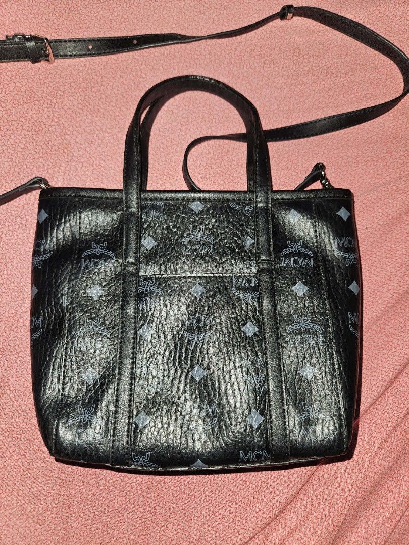 MCM Mini Toni top-zip shopper tote (Category: Luxury Bags & Wallets) located in Quezon City. Submitted by finding.a.second.home (Listing ID 1419958868, Image 2). Description: - NGA MCM -SOURCED FROM KOREA - Detachable shoulder strap - Exterior: MCM logo pattern - Interior: MCM logo patterned lining - YKK ZIP - WITH ETIKETA -RATING 9/10 -.