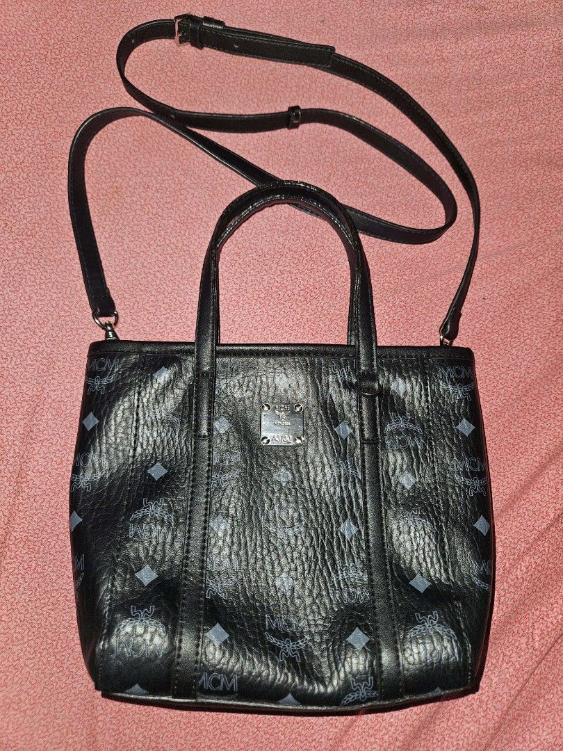 MCM Mini Toni top-zip shopper tote (Category: Luxury Bags & Wallets) located in Quezon City. Submitted by finding.a.second.home (Listing ID 1419958868, Image 1). Description: - NGA MCM -SOURCED FROM KOREA - Detachable shoulder strap - Exterior: MCM logo pattern - Interior: MCM logo patterned lining - YKK ZIP - WITH ETIKETA -RATING 9/10 -.