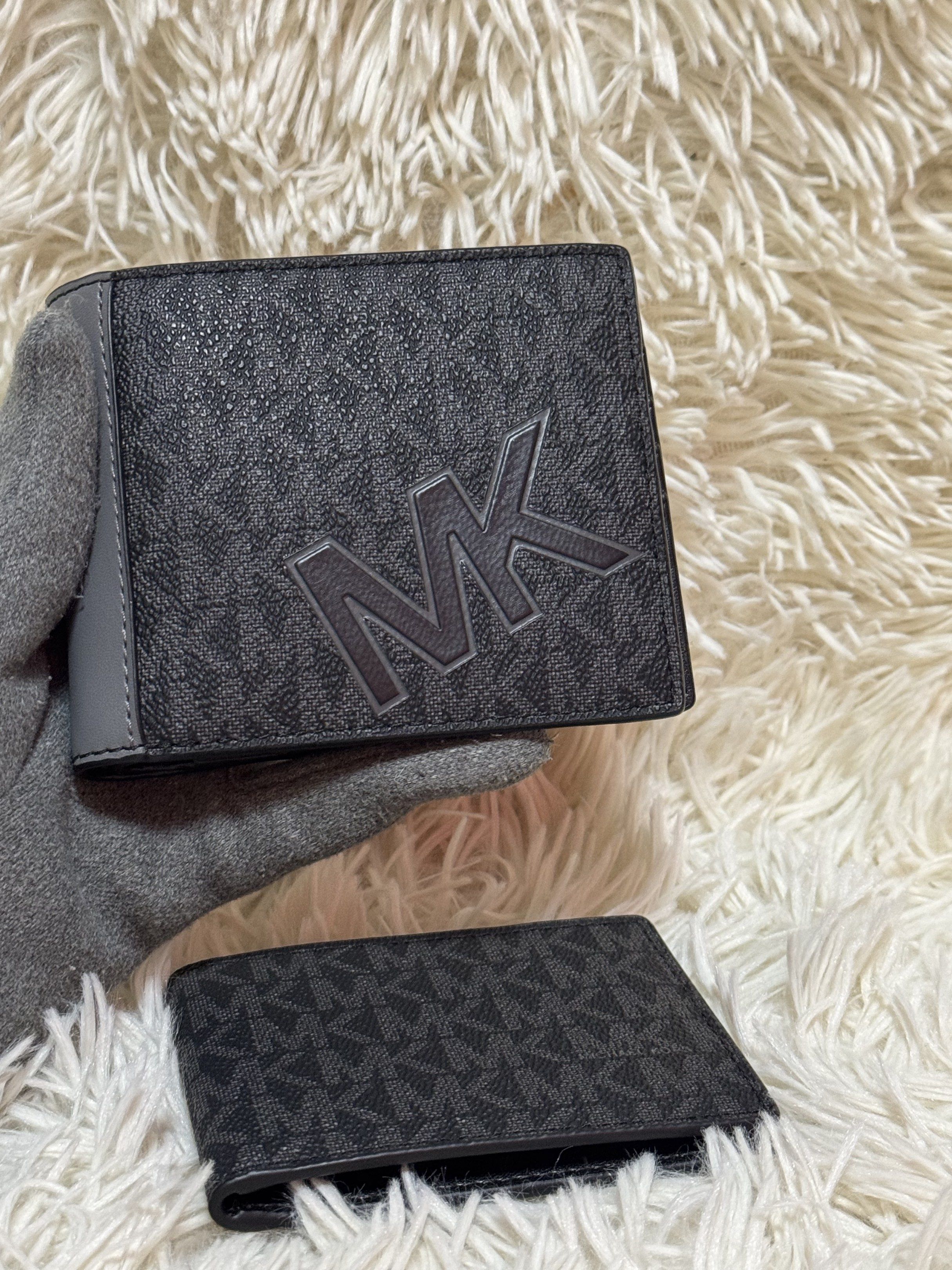 Michael Kors MK Logo Wallet Set (Category: Luxury Bags & Wallets) located in Rodriguez. Submitted by nancyb13 (Listing ID 1419875867, Image 3). Description: Set includes a bi-fold wallet and a cardholder, both featuring the iconic MK logo pattern. The bi-fold wallet has multiple card slots and a clear ID window. The cardholder is compact and designed for essential cards. Both items are black with the MK logo in a darker shade. The interior of the