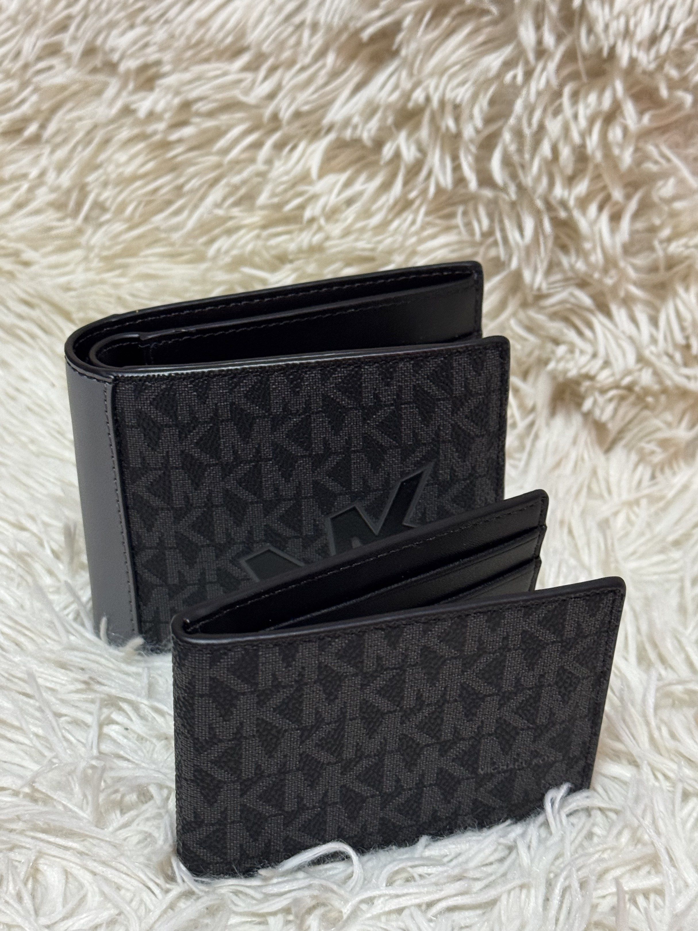 Michael Kors MK Logo Wallet Set (Category: Luxury Bags & Wallets) located in Rodriguez. Submitted by nancyb13 (Listing ID 1419875867, Image 1). Description: Set includes a bi-fold wallet and a cardholder, both featuring the iconic MK logo pattern. The bi-fold wallet has multiple card slots and a clear ID window. The cardholder is compact and designed for essential cards. Both items are black with the MK logo in a darker shade. The interior of the
