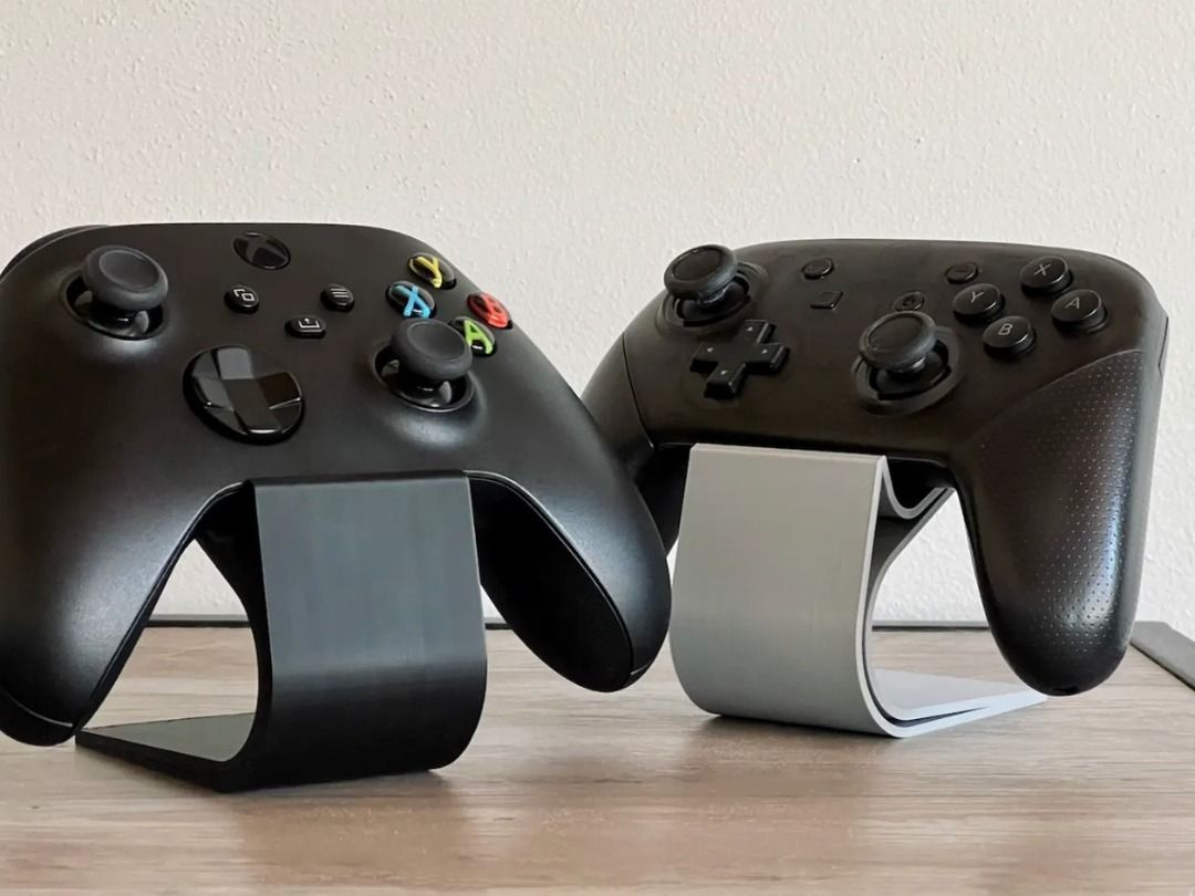 Minimalist Game Controller Stand | Desk Display Holder (Category: Cases & Covers) located in Mandaluyong City. Submitted by heyitslaaaance (Listing ID 1419828157, Image 3). Description: Upgrade your gaming setup with this Universal Controller Stand, built for a clean, premium look while securely holding your favorite game controllers. 🔹 Fits All Major Controllers Xbox Controllers PlayStation (PS4 / PS5) Controllers Nintendo Switch Pro Controller