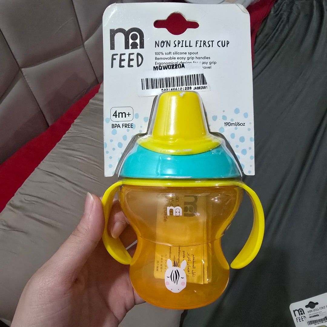 Mothercare Non spill first cup (Category: Weaning & Toddler Feeding) located in Manila. Submitted by cat.dee (Listing ID 1419975131, Image 1). Description: - Mothercare Non-Spill First Cup - Suitable for babies 4 months and up - Features a vibrant yellow and blue color scheme - Designed with easy-grip handles for little hands - Made with a soft silicone spout.