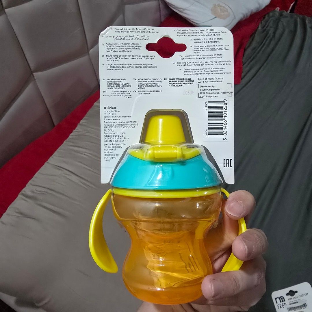 Mothercare Non spill first cup (Category: Weaning & Toddler Feeding) located in Manila. Submitted by cat.dee (Listing ID 1419975131, Image 2). Description: - Mothercare Non-Spill First Cup - Suitable for babies 4 months and up - Features a vibrant yellow and blue color scheme - Designed with easy-grip handles for little hands - Made with a soft silicone spout.
