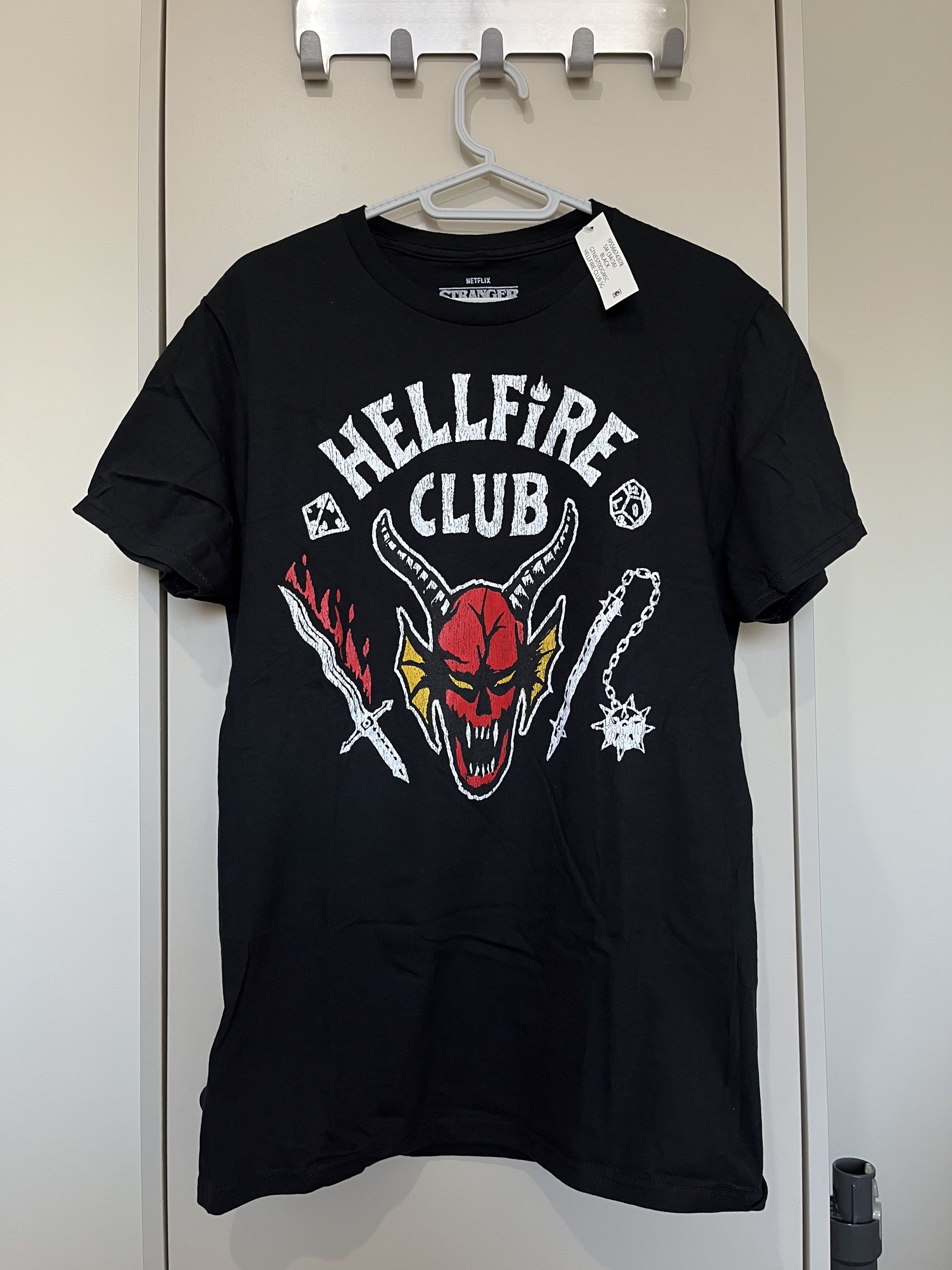 Netflix Stranger Things Hellfire Club T-shirt (Category: Tshirts & Polo Shirts ) located in Rizal. Submitted by brandonpro74914 (Listing ID 1419946772, Image 1). Description: - Brandnew - Negotiable - Stranger Things Hellfire Club T-shirt - Features the Hellfire Club logo - Size: S/C/P (34/36) - Material: 100% cotton - Made in El Salvador - Includes original tag.