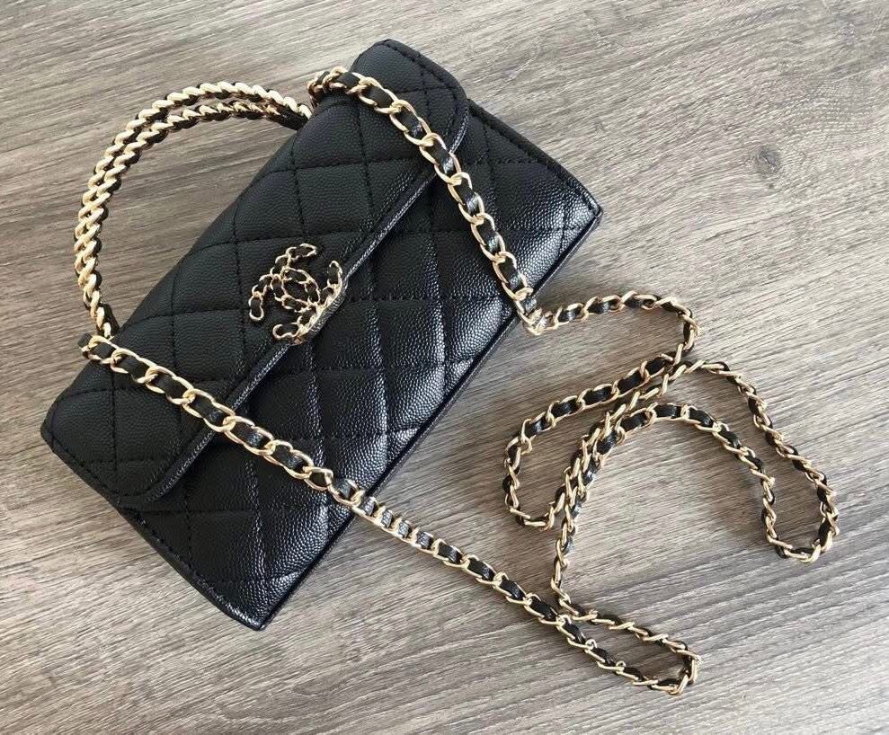 ON HAND Black Quilted Handbag with Chain (Category: Luxury Bags & Wallets) located in General Trias. Submitted by godgraceisreal_ph (Listing ID 1419854878, Image 1). Description: ON HAND, 2 piece available READY TO SHIP VIA LALAMOVE, LBC Complimentary Chanel VIP gift wallet on chain -Black quilted wallet on chain handbag - Gold chain strap - Gold Chanel logo - Flap closure - Leather material - Top handle - Long chain strap (shoulder/crossbody).