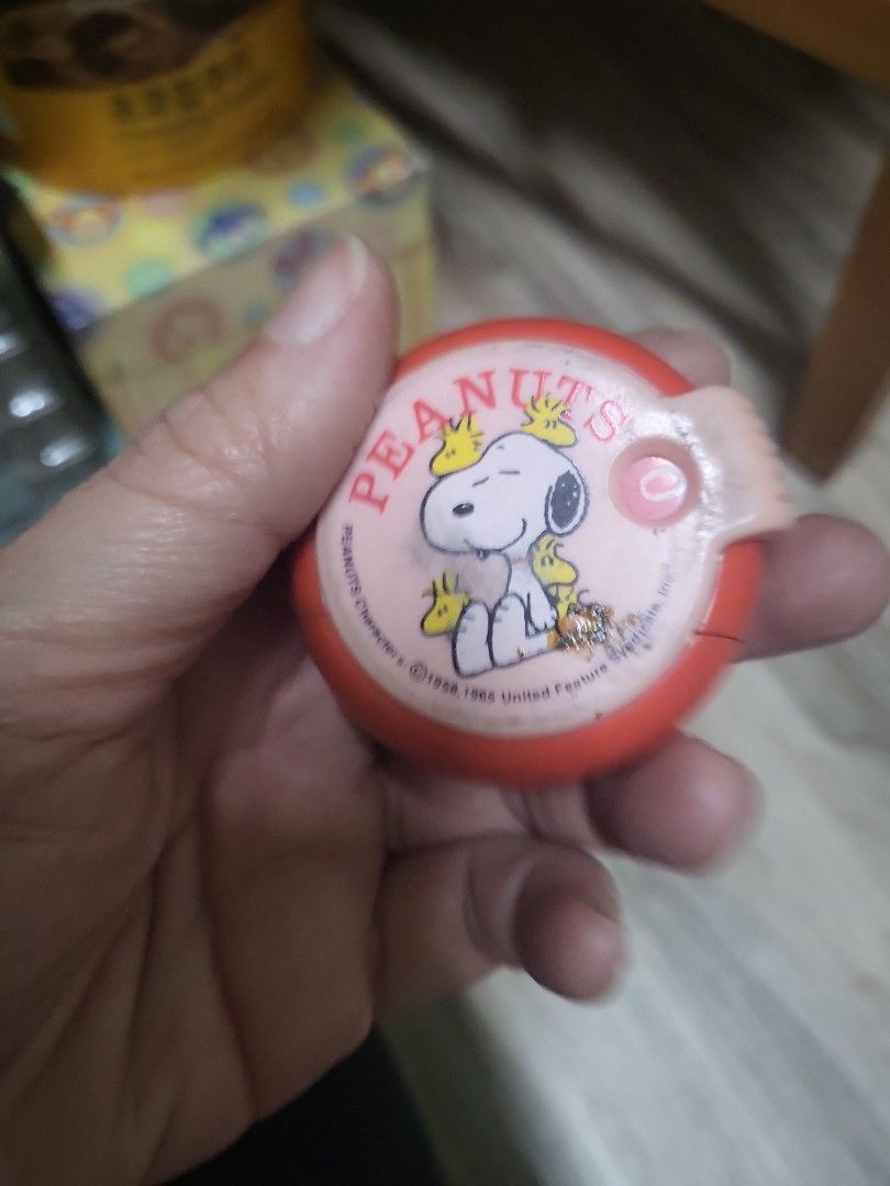 Peanuts Snoopy Pencil Sharpener (Category: Vintage Collectibles) located in Caloocan City. Submitted by lynette1977 (Listing ID 1419961196, Image 1). Description: - Vintage Peanuts Snoopy pencil sharpener - Features Snoopy on top - Red and pink color scheme - Includes pencil sharpening hole and shavings opening - A collectible item - Ideal for Peanuts enthusiasts.