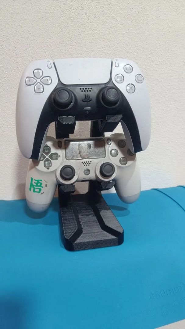 PlayStation Controller Stand | Fits PS4 & PS5 | Double Slot (Category: Cases & Covers) located in Mandaluyong City. Submitted by heyitslaaaance (Listing ID 1419826763, Image 1). Description: Upgrade your gaming setup with this PS4 & PS5 Dual Controller Stand! Designed to hold two controllers securely—perfect for keeping your desk or entertainment area neat, organized, and stylish. 🔹 Features Compatible with both PS4 and PS5 controllers Dual-slot