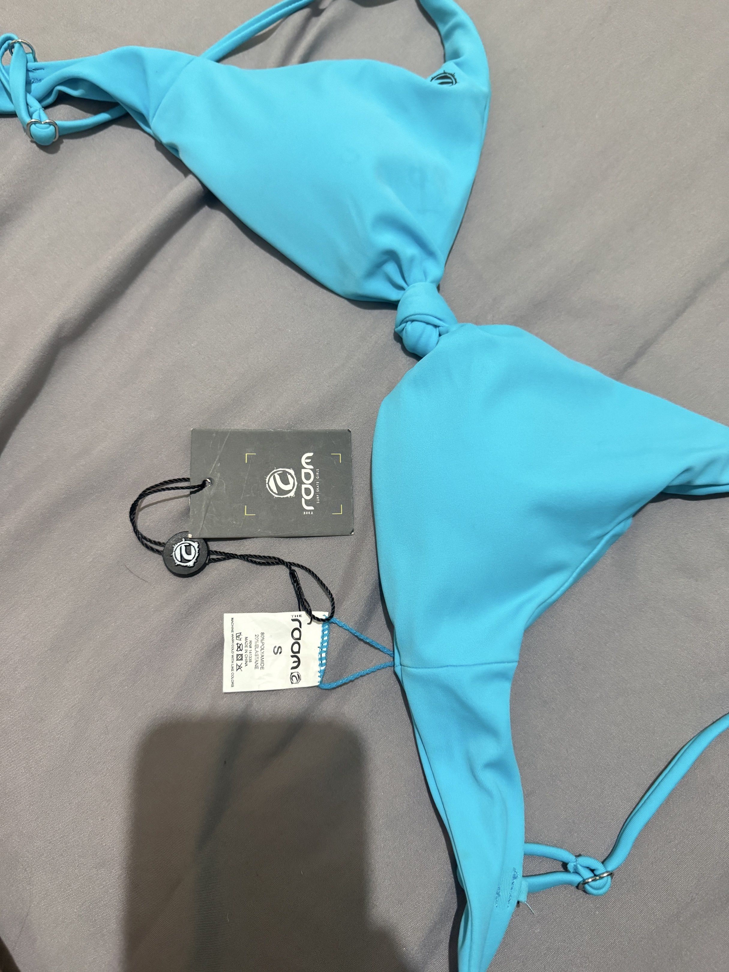 Rooom Bikini Top - Size S - Turquoise (Category: Bikinis & Swimsuits) located in Pasig City. Submitted by caaex (Listing ID 1419939123, Image 2). Description: - Rooom turquoise bikini top - Size: S - Design: Knotted center - Features: Adjustable straps - Condition: New with tags.