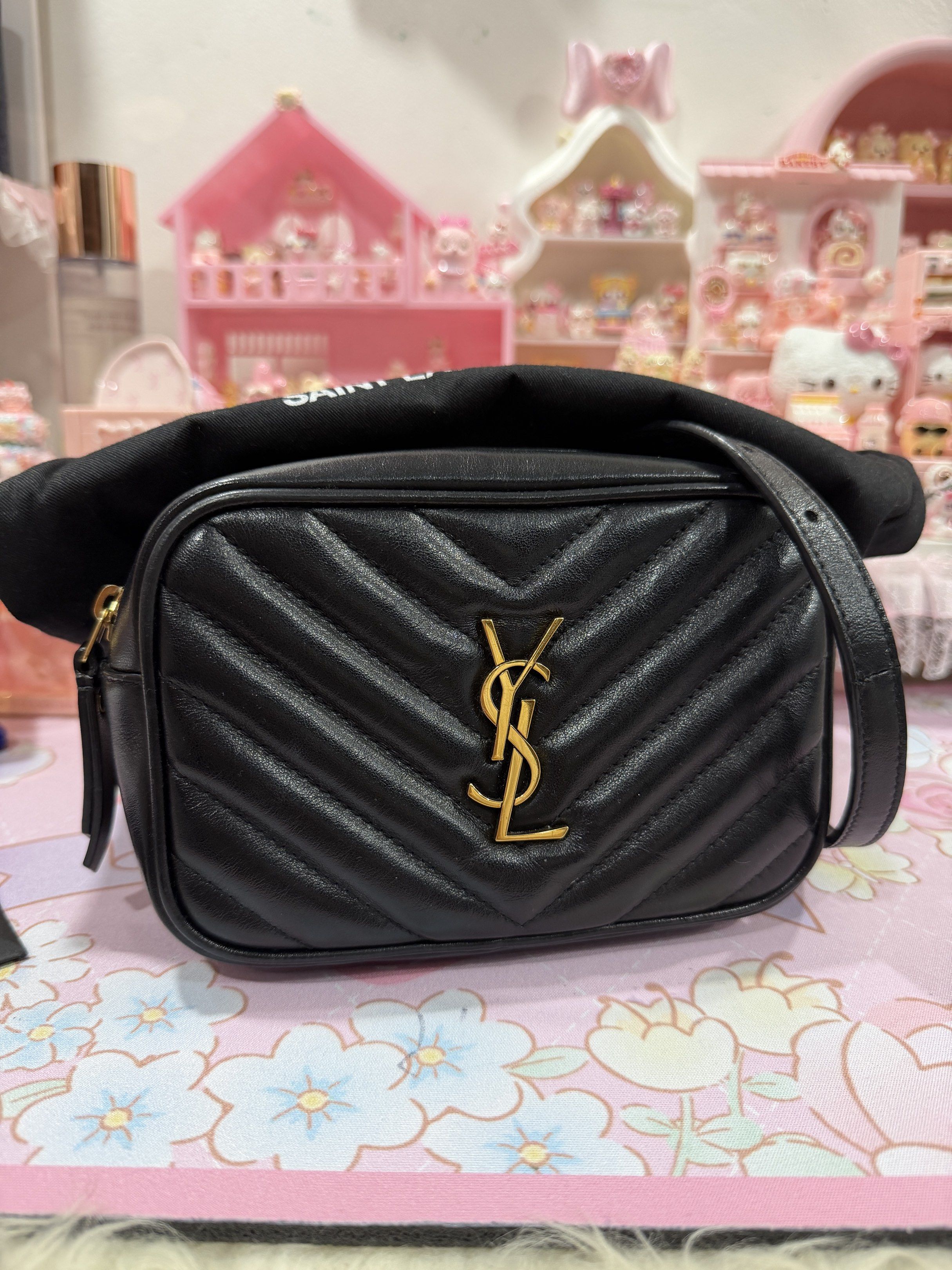 Saint Laurent Lou Camera Bag (Category: Luxury Bags & Wallets) located in Caloocan City. Submitted by mavs_alinas (Listing ID 1419962363, Image 3). Description: Original money back if proven fake 😉 - Saint Laurent Lou Camera Bag - Black, chevron-quilted design - Gold-tone YSL logo - Detachable shoulder strap - Tassel detail - Top zip closure - Interior pocket - Includes dust bag - Includes Saint Laurent card.
