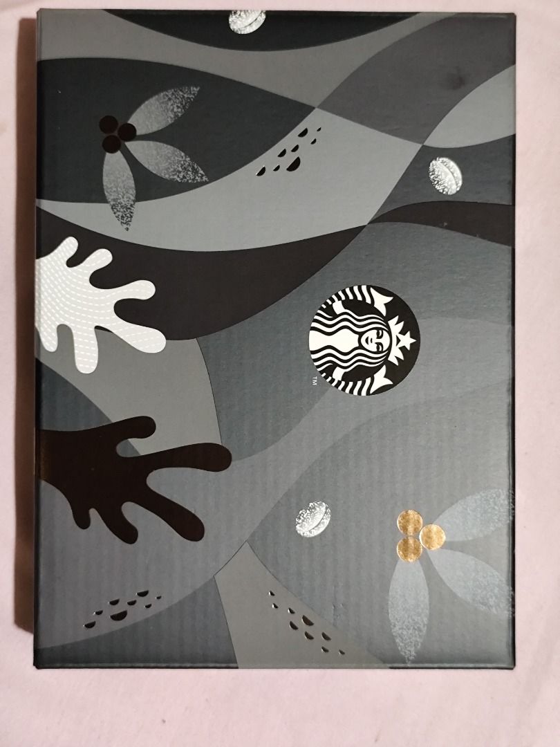 Starbucks Planner 2026 with Box (Category: Stationery & School Supplies) located in Mandaluyong City. Submitted by msdeclutterfinds (Listing ID 1419945578, Image 3). Description: - Starbucks Planner with matching box - Features a black cover with Starbucks logo and abstract design - Includes a pen and notebook - Brand new, in original packaging.