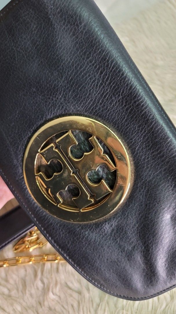 Tory Burch Black Clutch with Chain (Category: Luxury Bags & Wallets) located in Cavite. Submitted by amairos (Listing ID 1419970904, Image 2). Description: nice condition supergold hardware minimal hair line small no flaws.