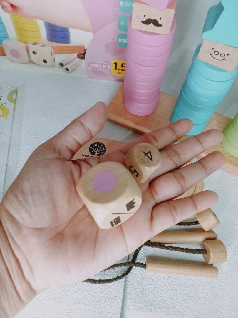 Woody Pudy Ring 10 Stacking Toy (Category: Educational & Learning Toys) located in Rosario. Submitted by elysedeclutter (Listing ID 1419939490, Image 3). Description: -missing 1 blue ring -replacement number dice.